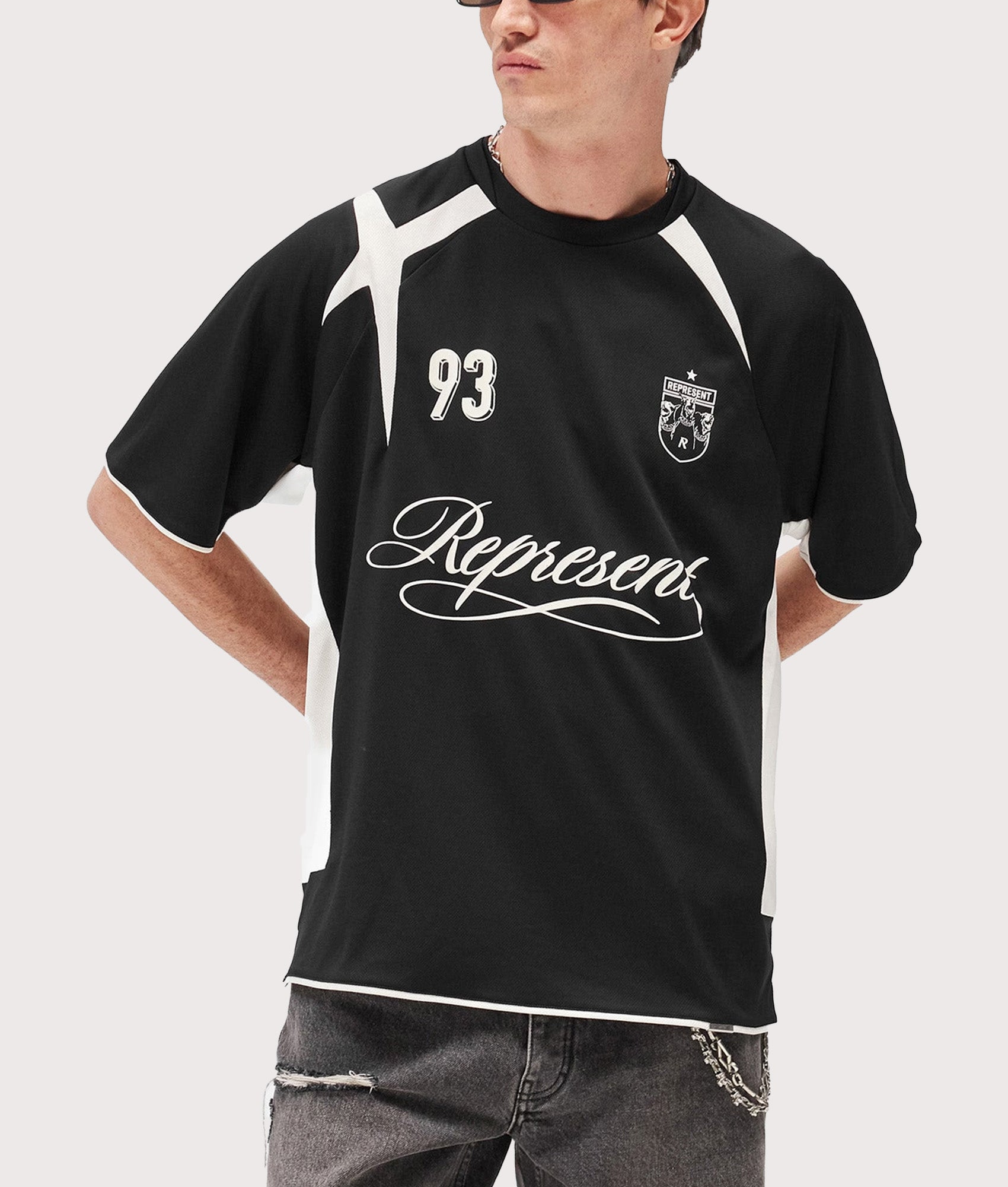Represent Oversized Star Football Top in Jet Black at EQVVS Menswear. Model front shot.
