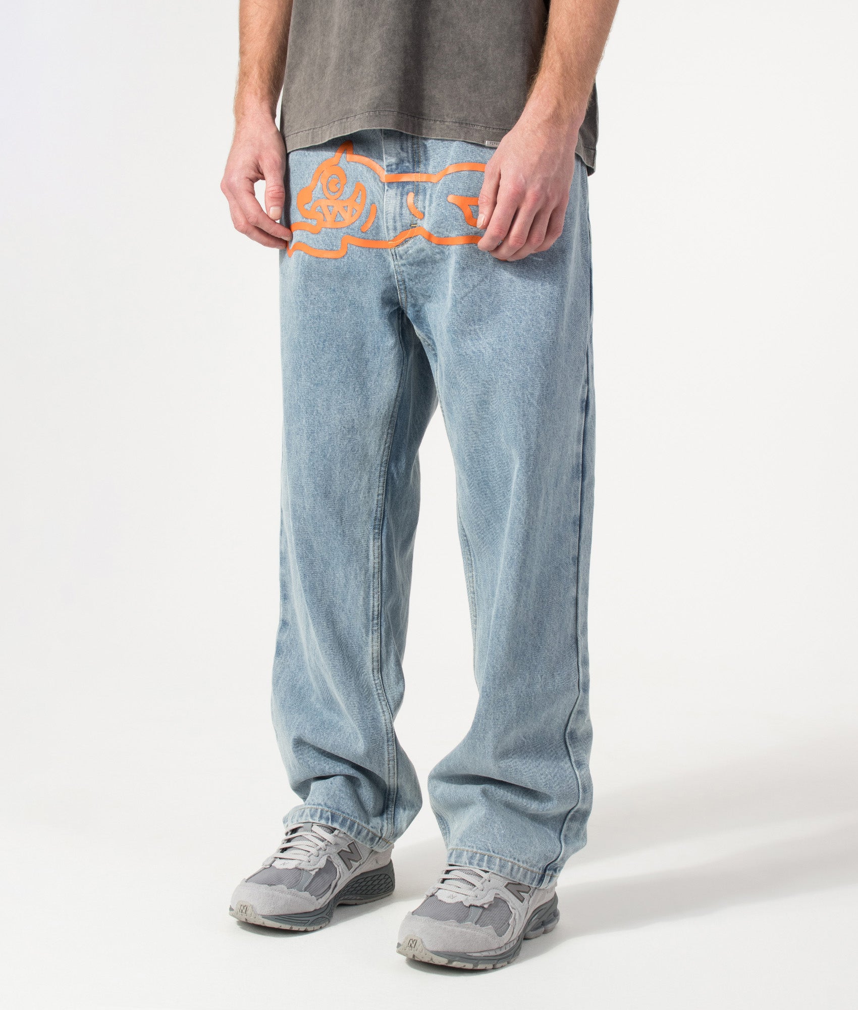 ICECREAM Running Dog Double Scoop Denim Jeans in Heavy Wash Blue at EQVVS Menswear. Angled model front shot.