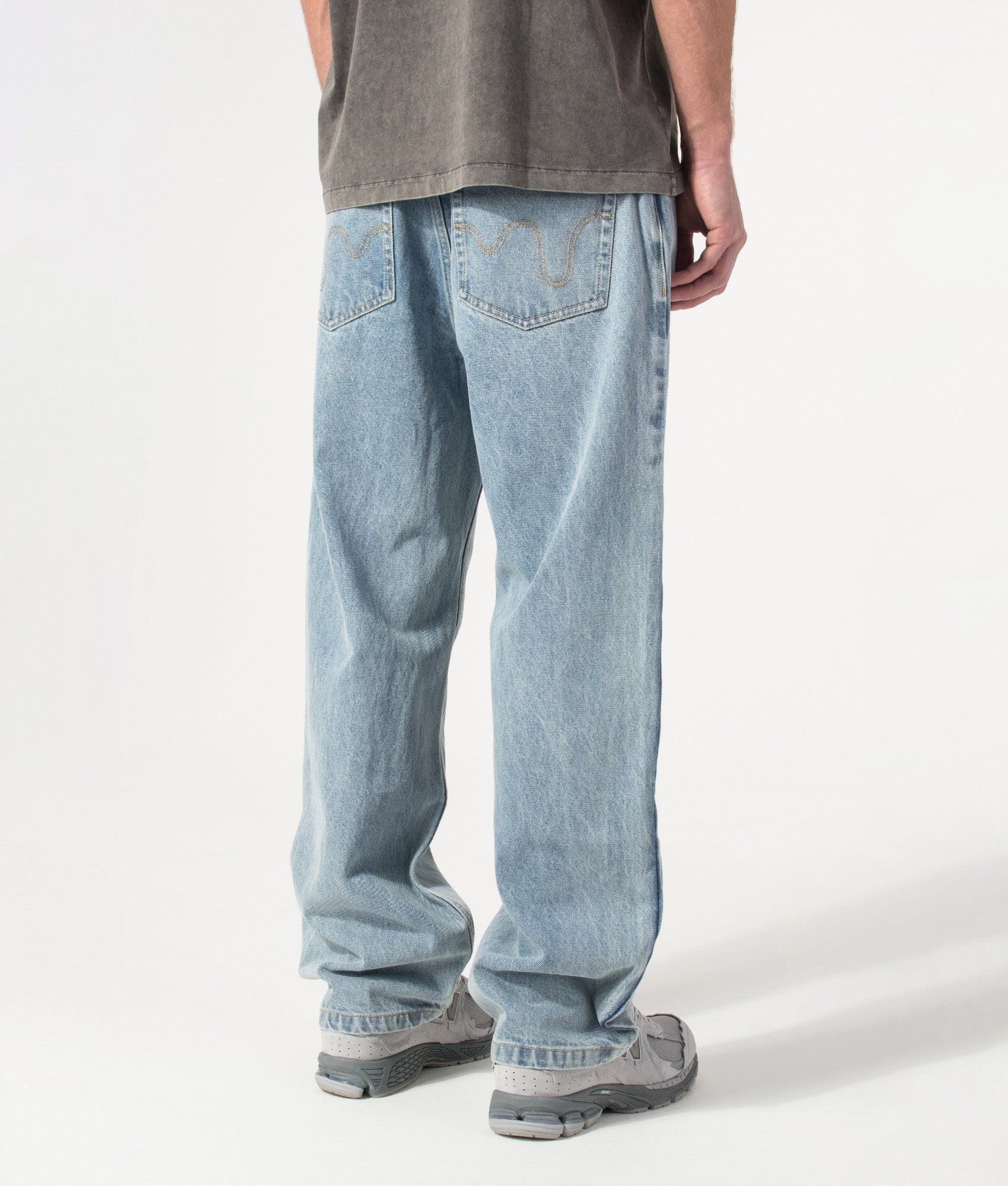 ICECREAM Running Dog Double Scoop Denim Jeans in Heavy Wash Blue at EQVVS Menswear. Angled model back shot.