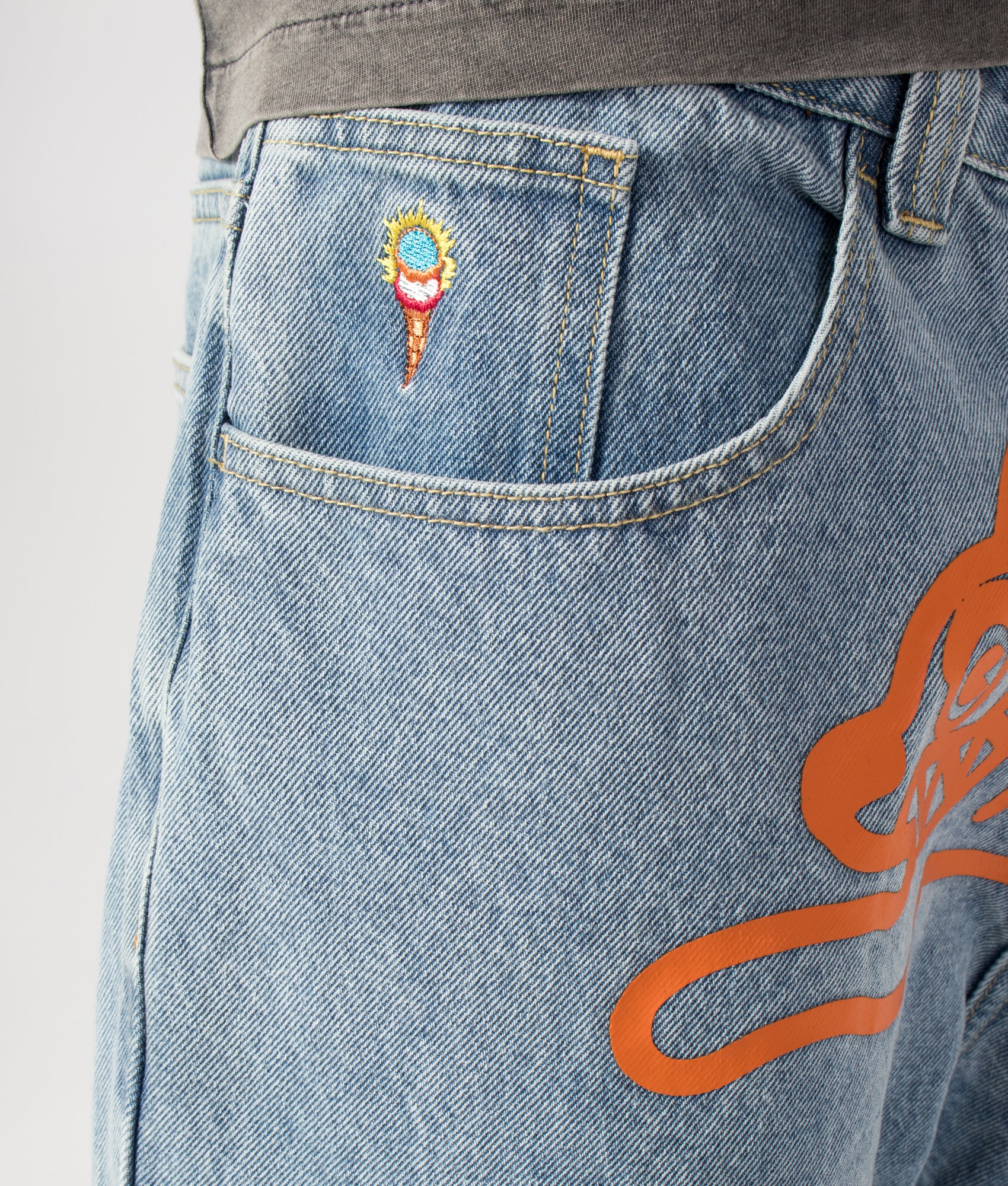 ICECREAM Running Dog Double Scoop Denim Jeans in Heavy Wash Blue at EQVVS Menswear. Front detail shot.