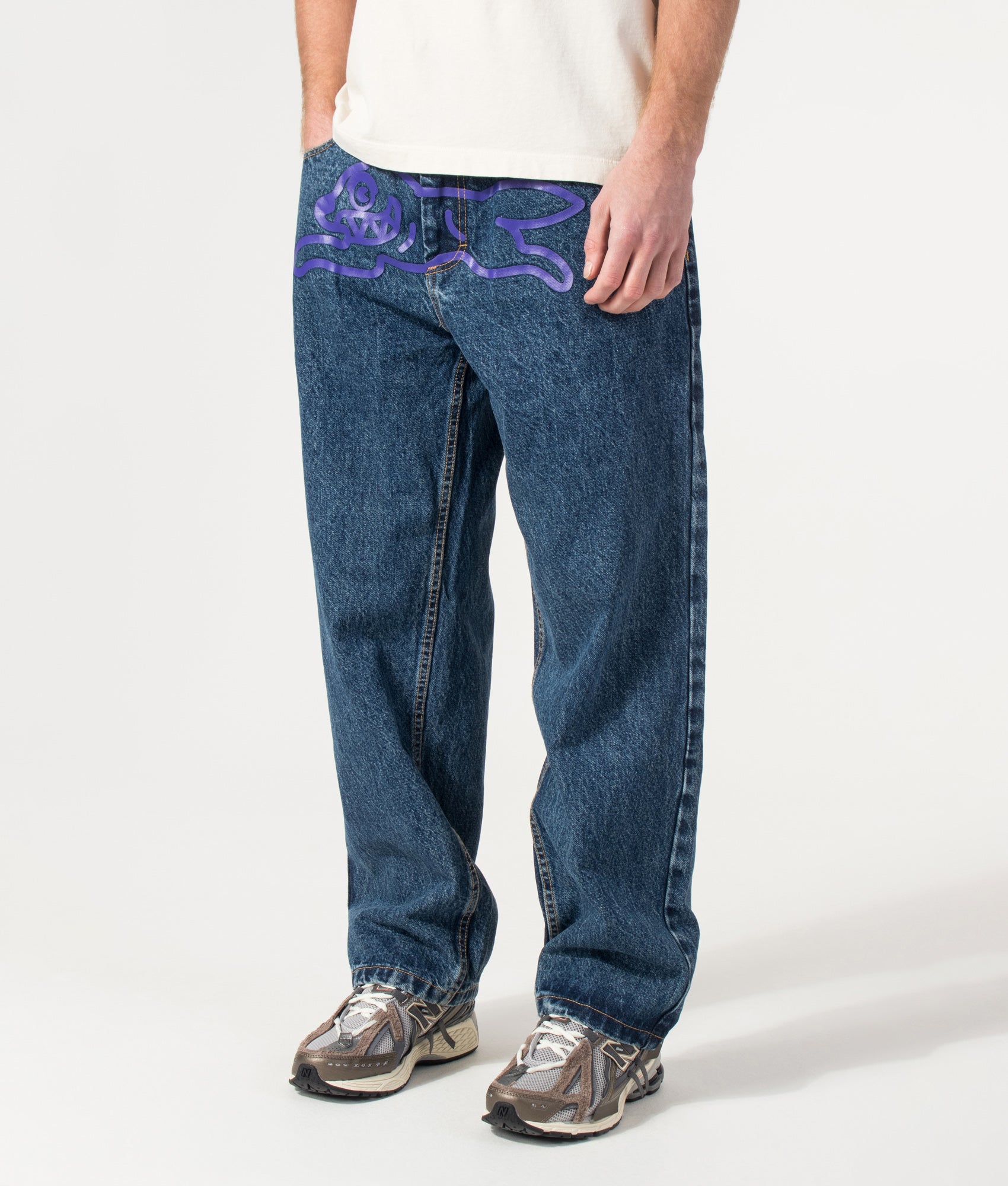 ICECREAM Running Dog Double Scoop Denim Jeans in Mid Wash Blue at EQVVS Menswear. Angled model front shot.