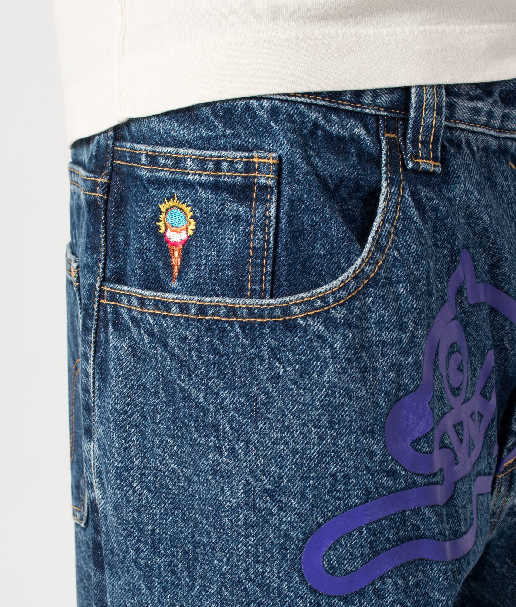 ICECREAM Running Dog Double Scoop Denim Jeans in Mid Wash Blue at EQVVS Menswear. Front detail shot.