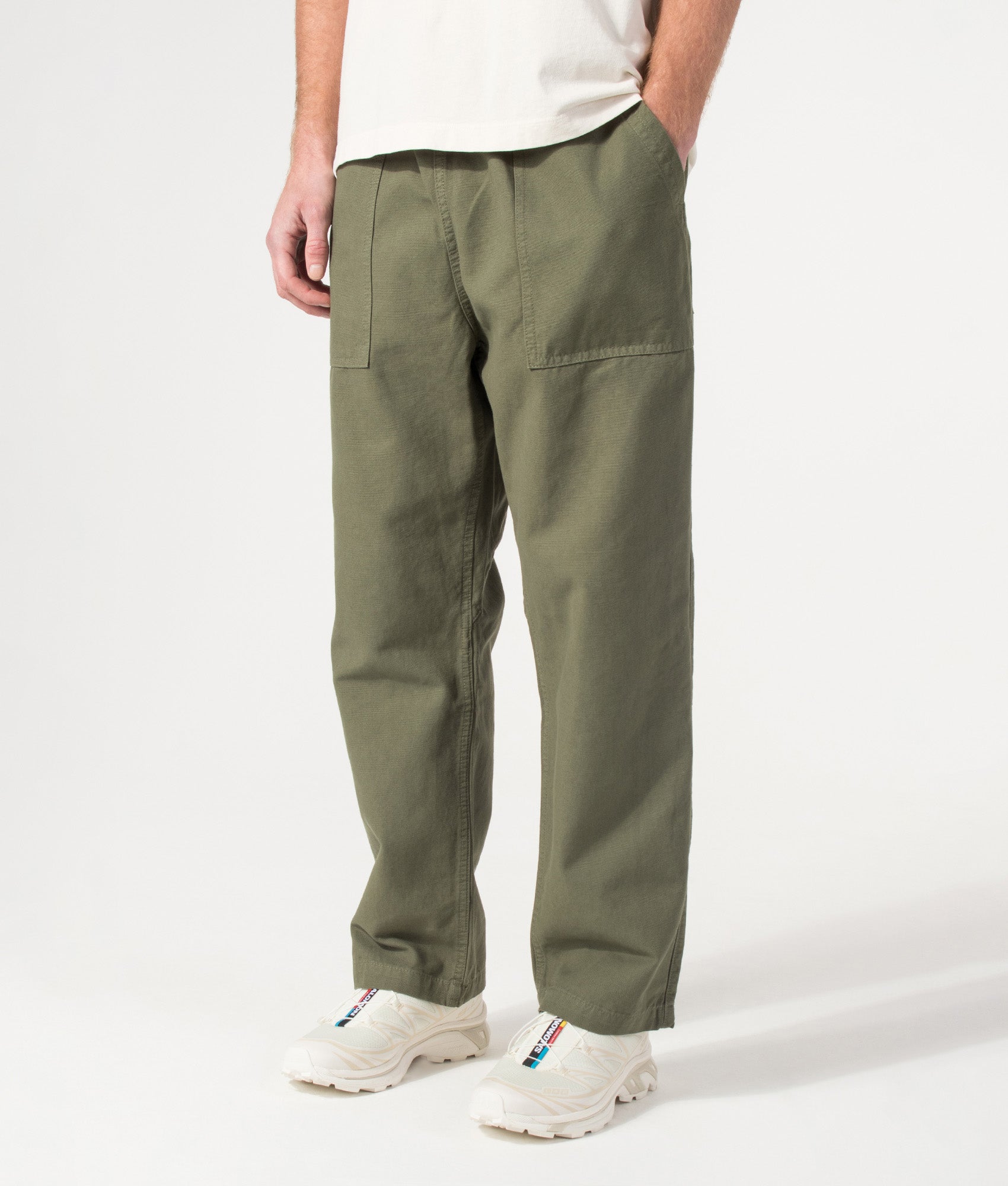 Canvas Chef Pants in Olive by Service Works. Shot by EQVVS. Front angled shot.