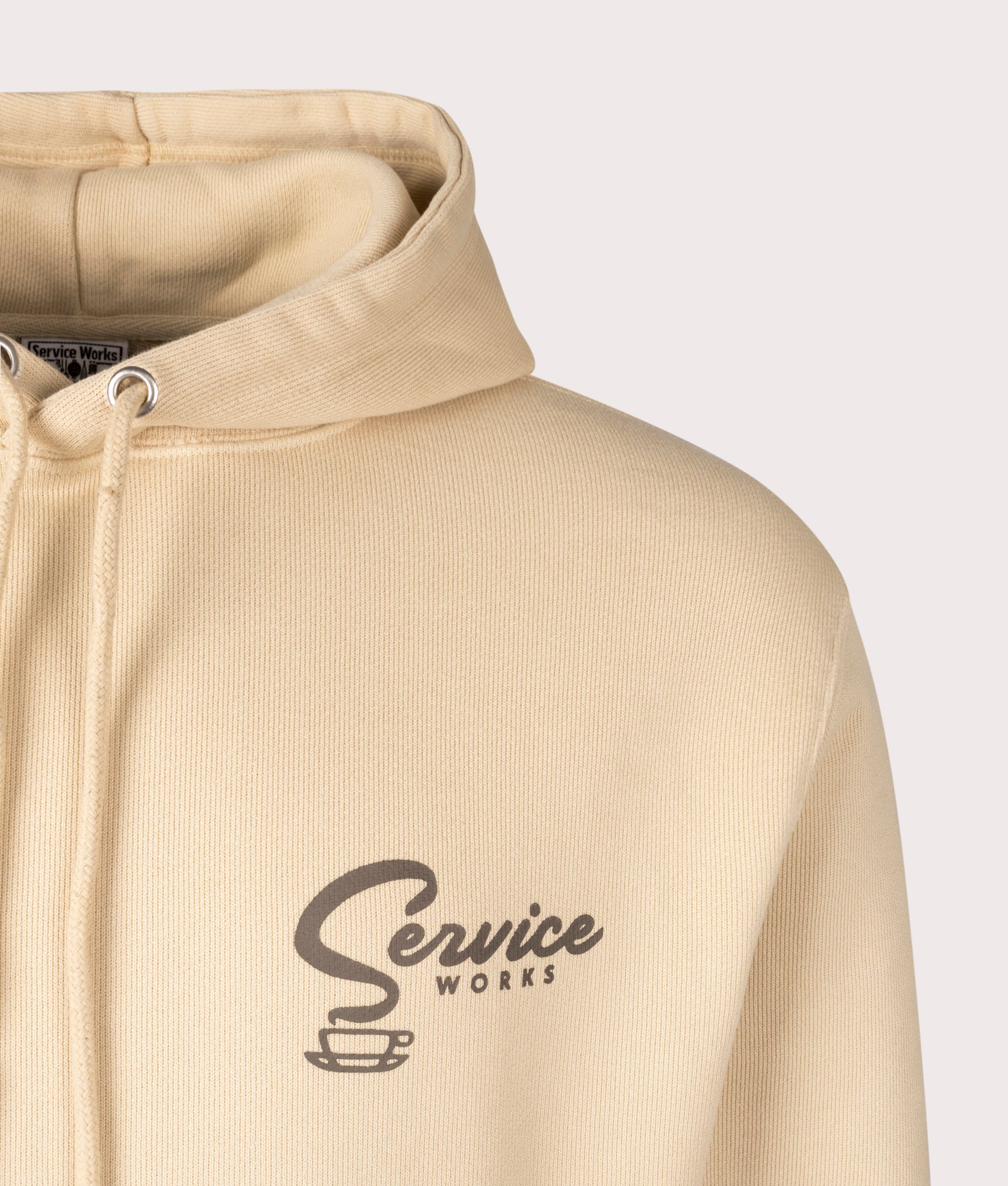 Service Works Espresso Hoodie in Khaki.  at EQVVS. Detail Shot.
