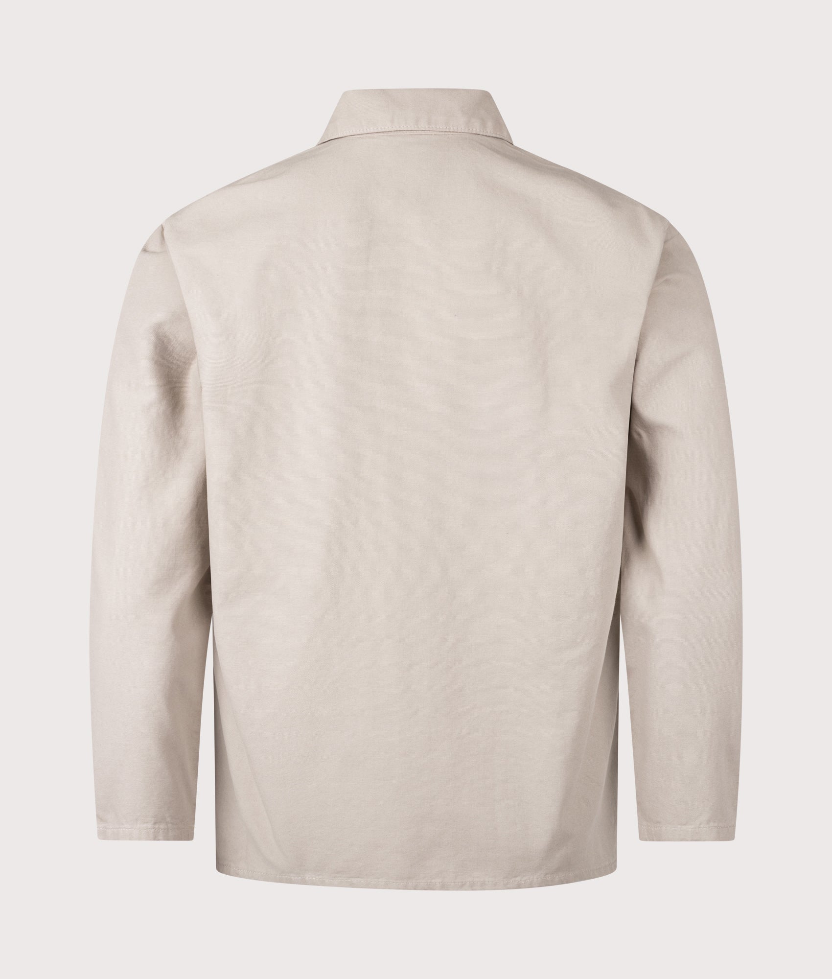 Service Works Canvas Chore Shirt in Stone at EQVVS Menswear. Back shot.
