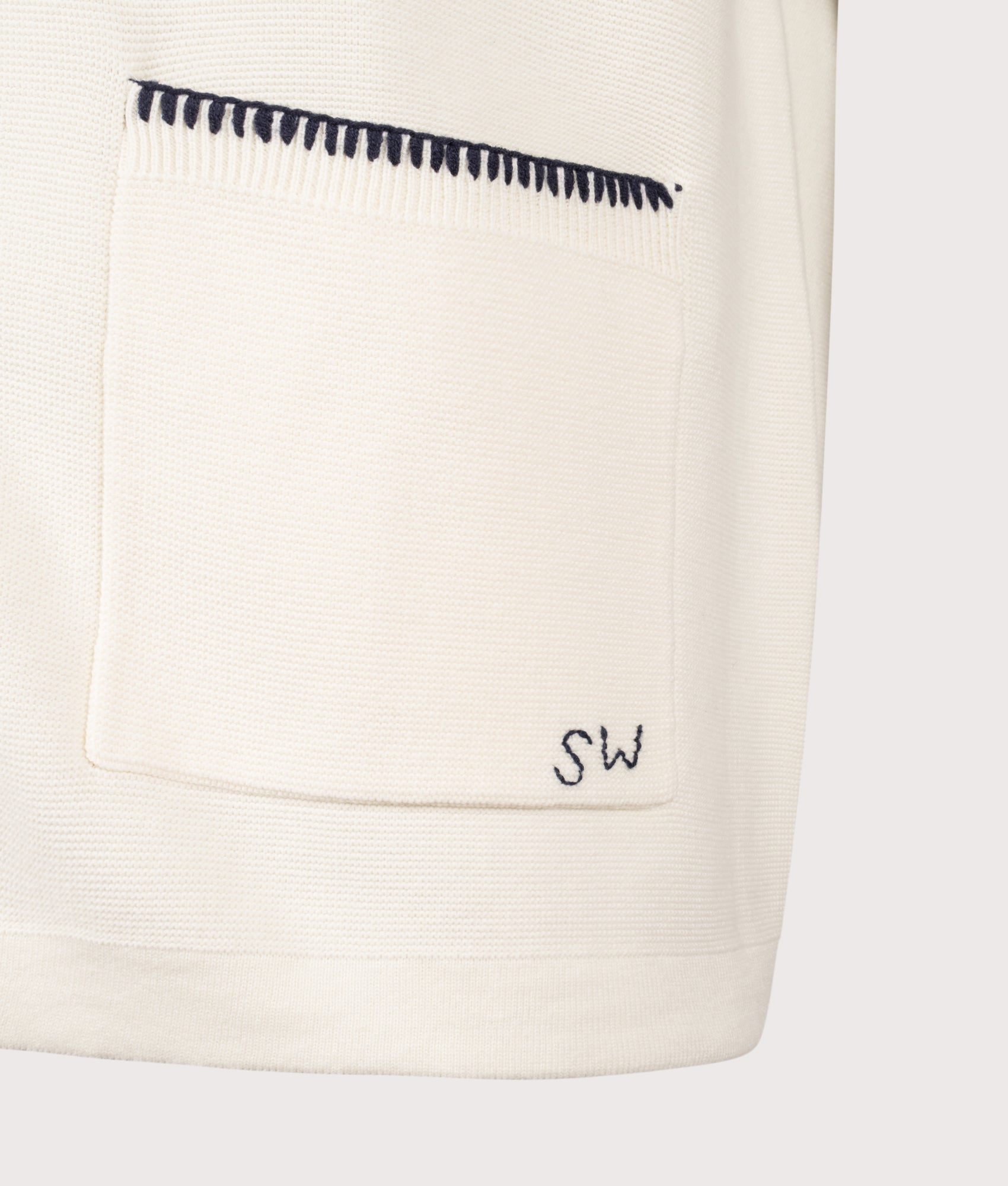 Service Works Blanket Stitch Short Sleeve Knitted Shirt in Off White at EQVVS Menswear. Detail shot.