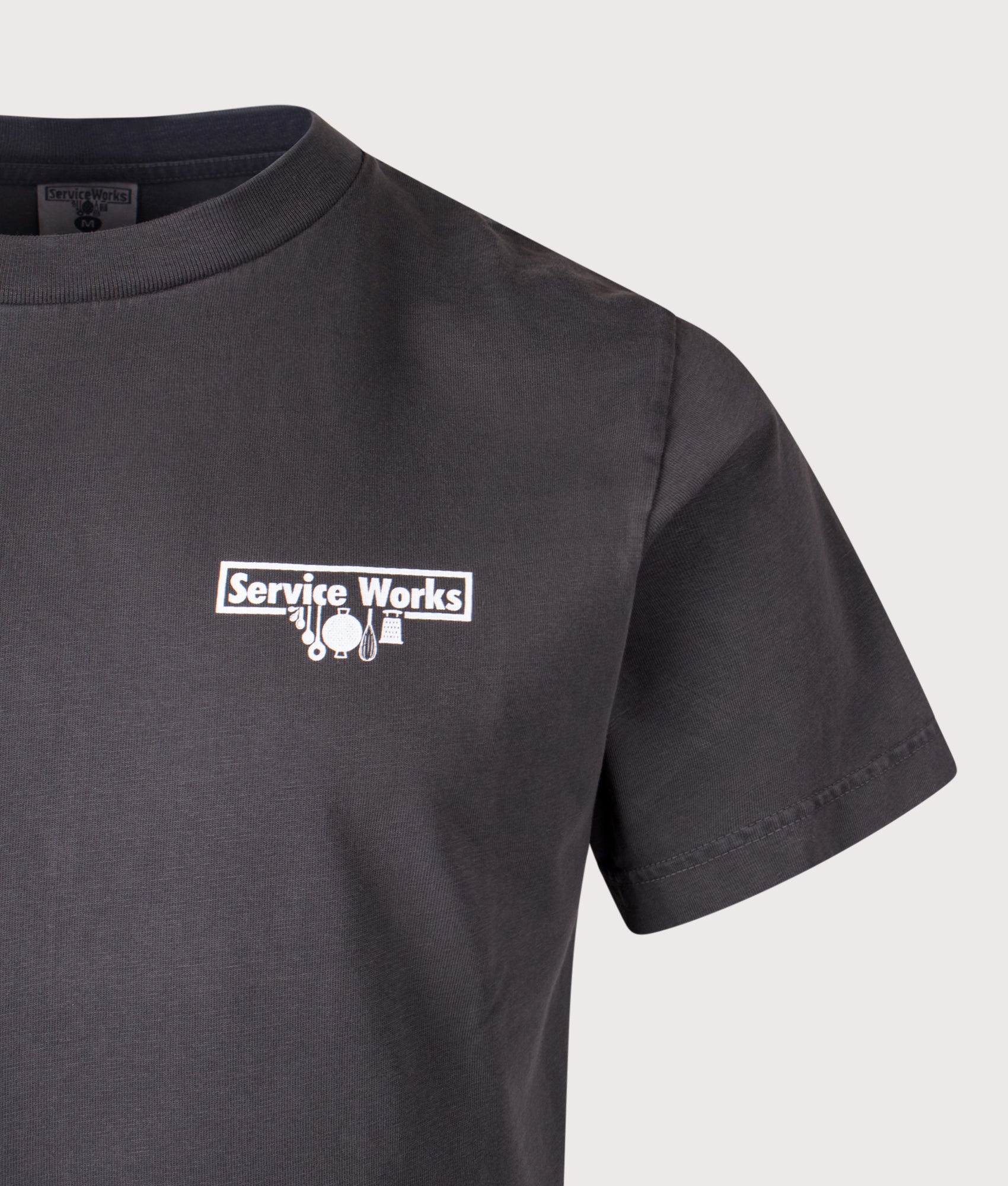 Services Works Pigment Dyed Trademark T-Shirt in Black at EQVVS Menswear. Detail shot.