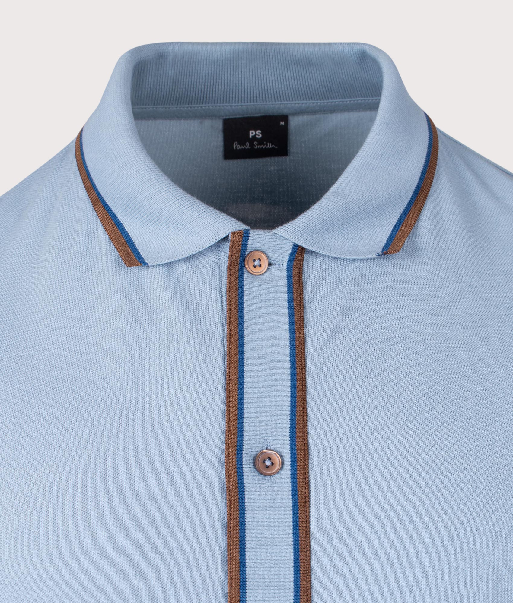 Paul Smith Button Front Polo Shirt in Blue at EQVVS Menswear. Detail shot.