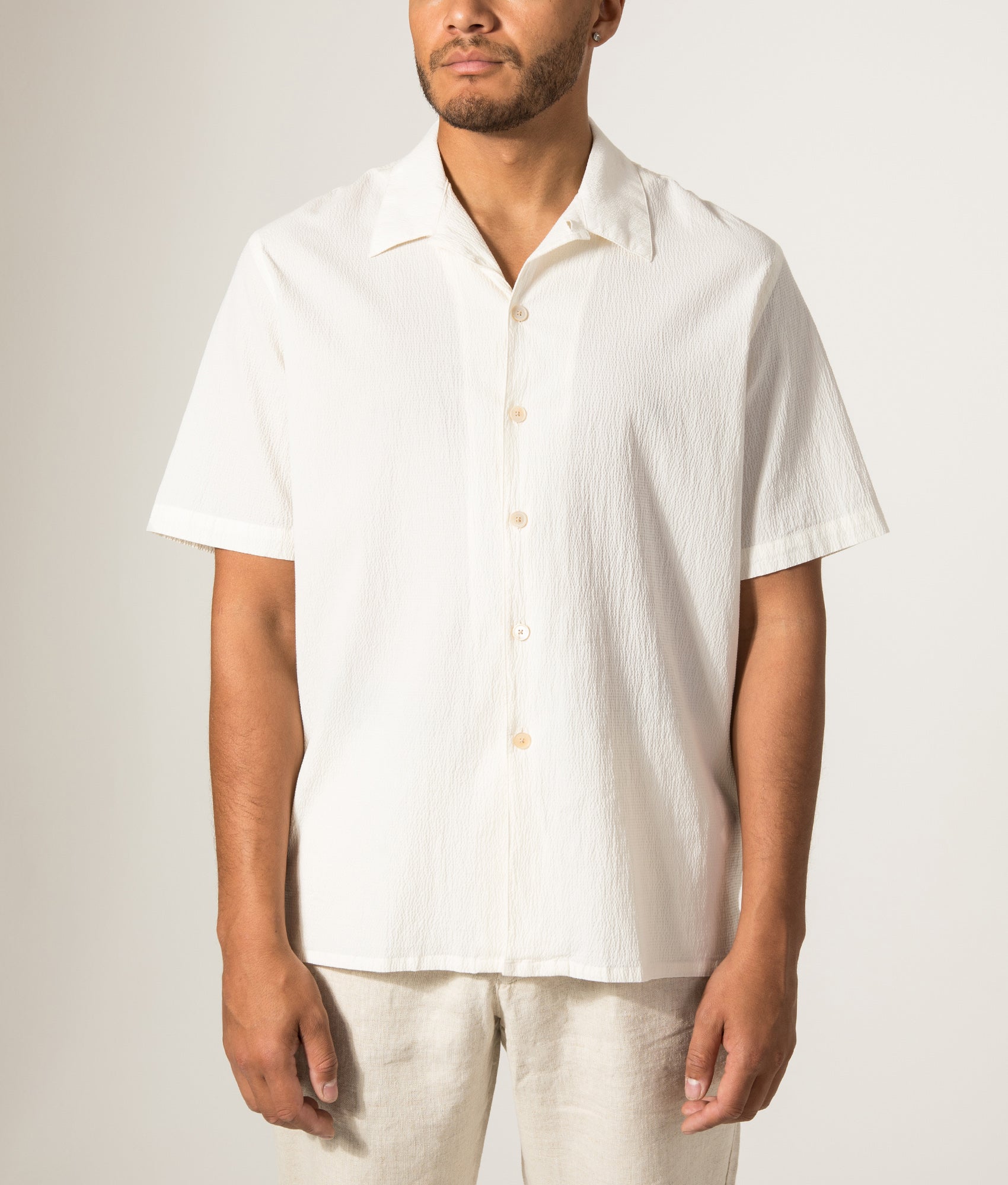 PS Paul Smith Relaxed Fit Short Sleeve Shirt in White at EQVVS Menswear. Model front shot.