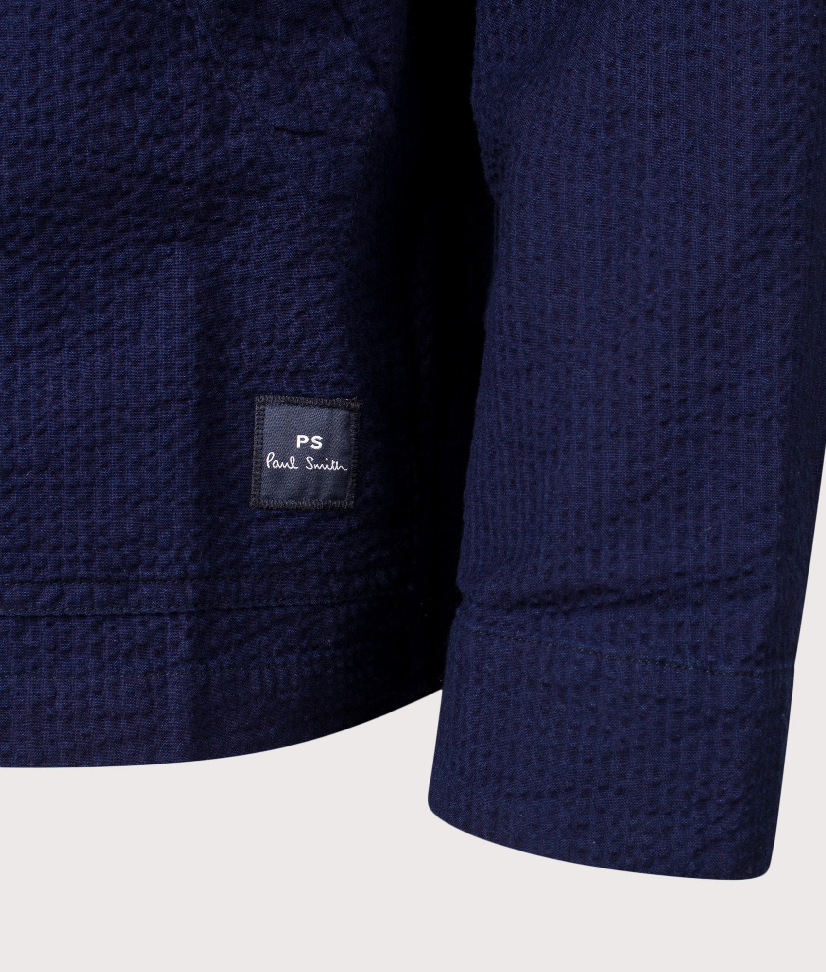 PS Paul Smith Relaxed Fit Cotton Seersucker Work Jacket in Blue at EQVVS Menswear. Detail shot.