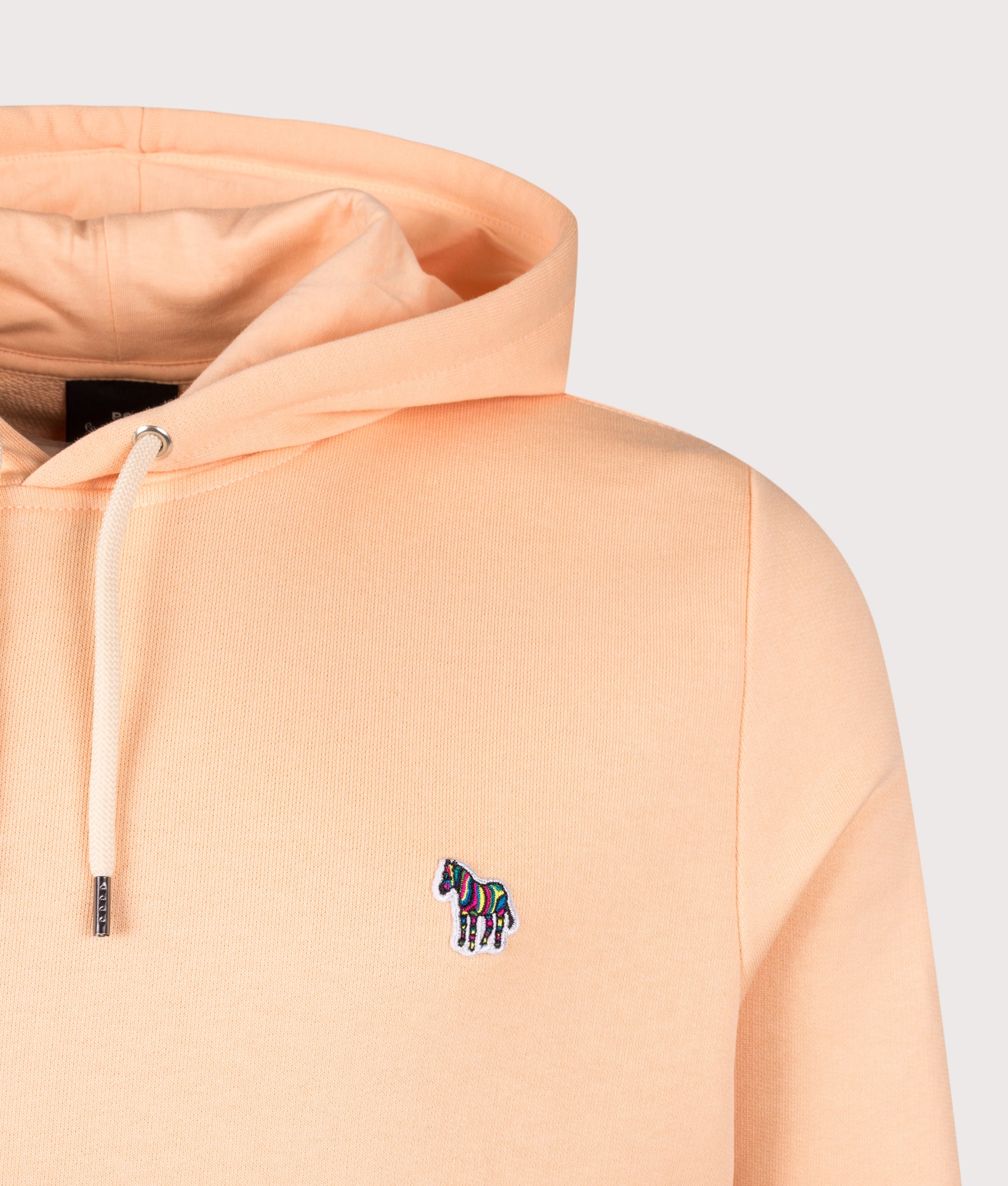 PS Paul Smith Zebra Hoodie in Orange at EQVVS Menswear. Detail shot.