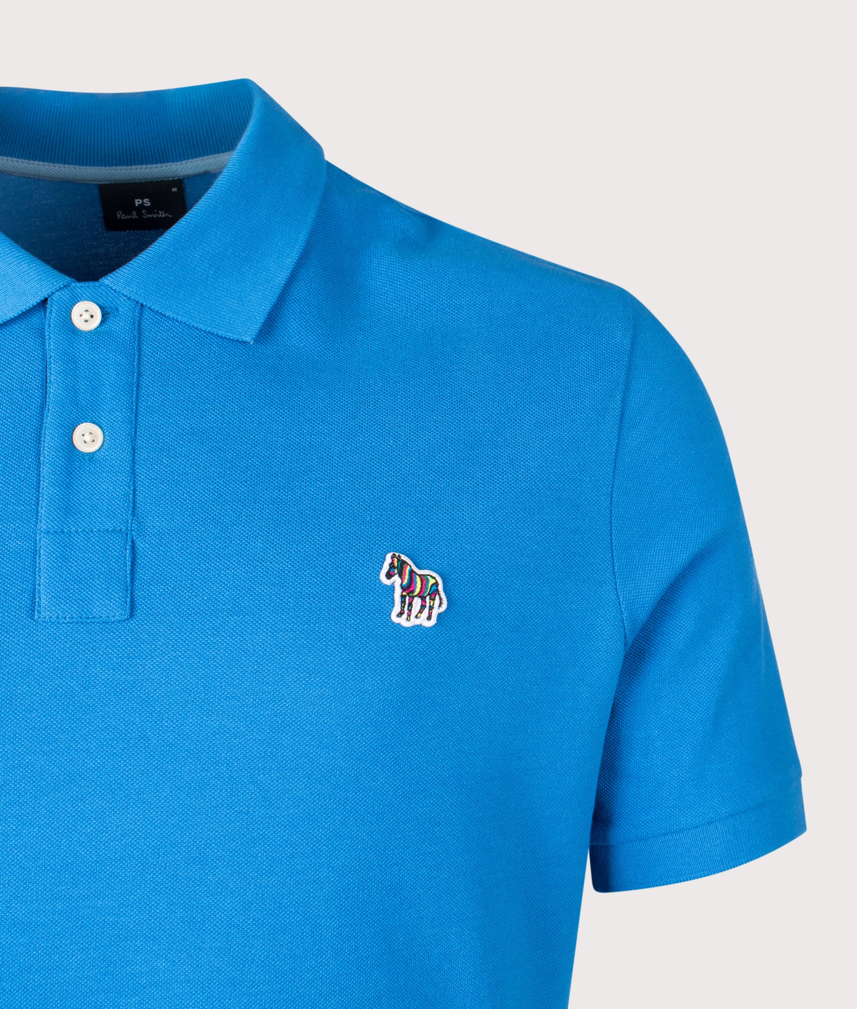 PS Paul Smith Zebra Polo Shirt in Blue at EQVVS Menswear. Detail shot.