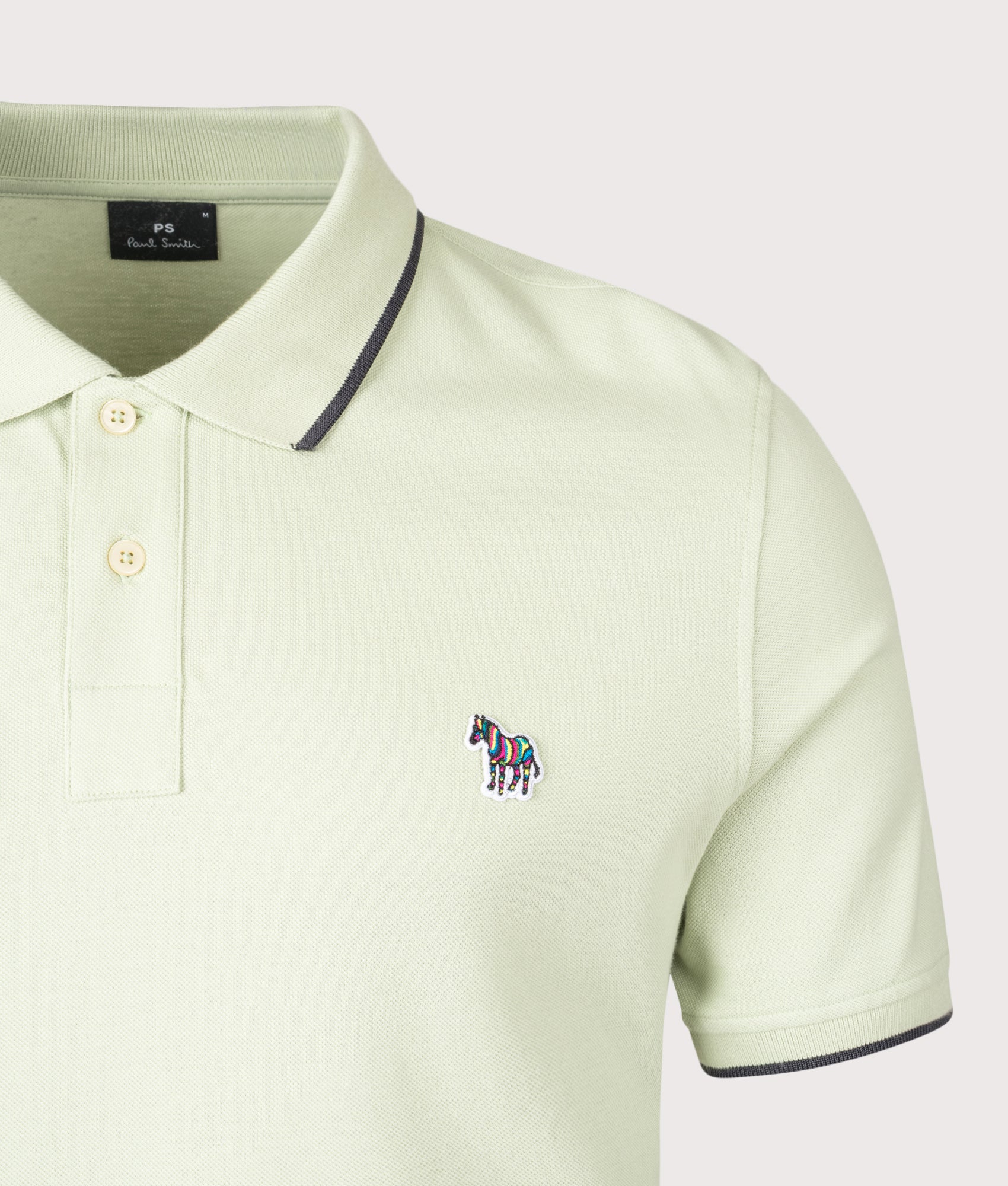 PS Paul Smith Zebra Badge Polo Shirt in Green at EQVVS Menswear. Detail shot.