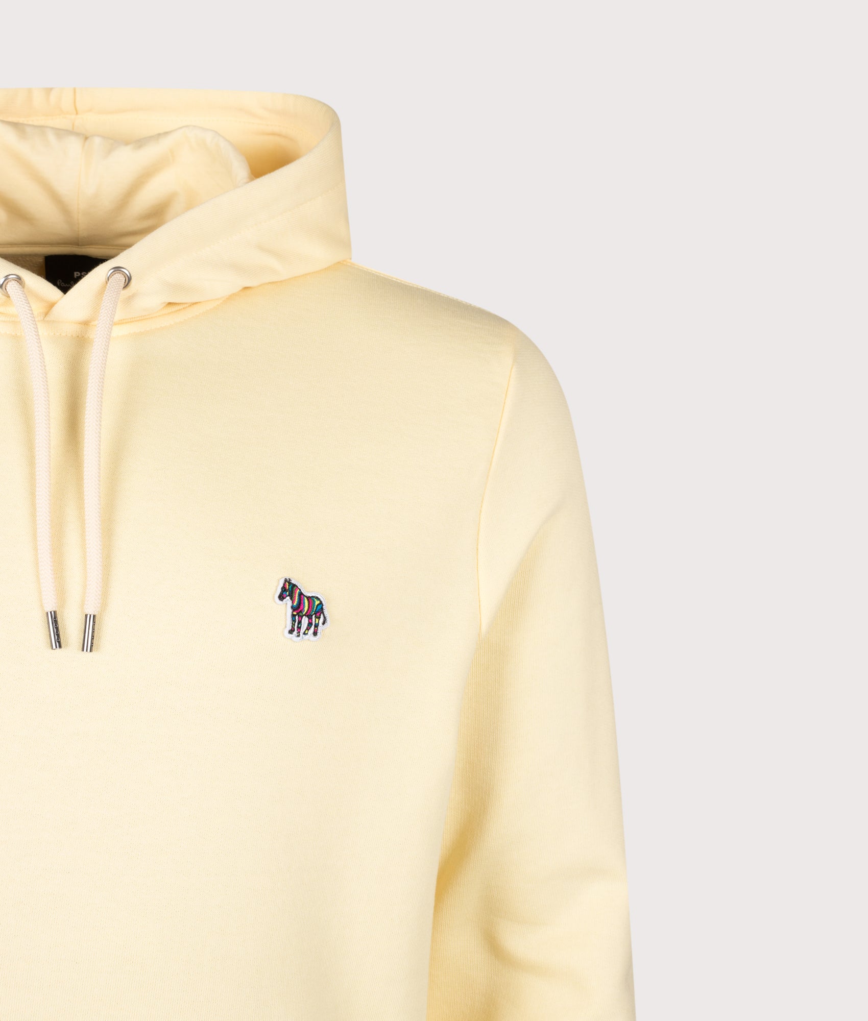 PS Paul Smith Zebra Logo Hoodie in Yellow at EQVVS Menswear. Detail shot.