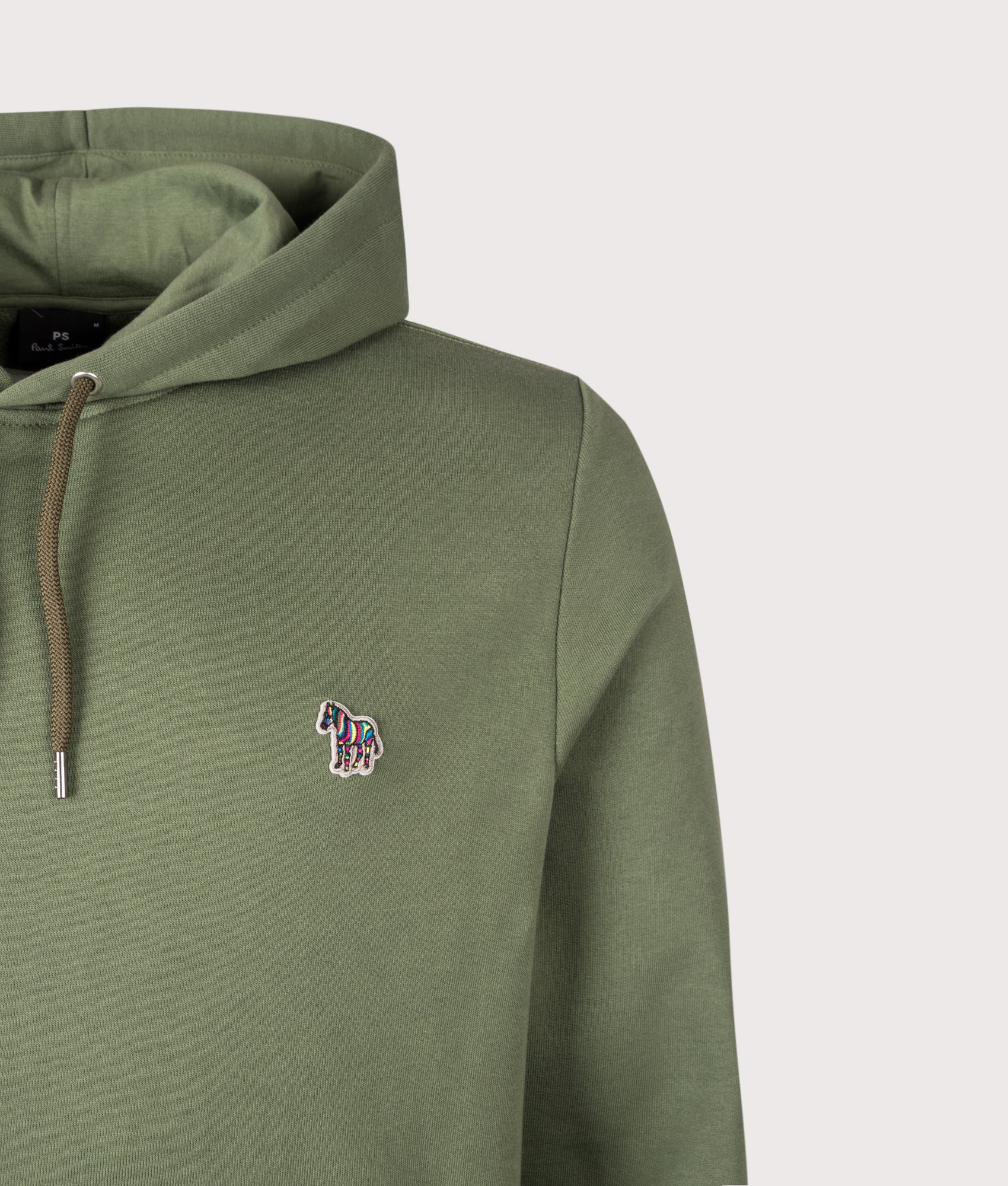 PS Paul Smith Zebra Logo Hoodie in Military Green at EQVVS Menswear. Detail shot.