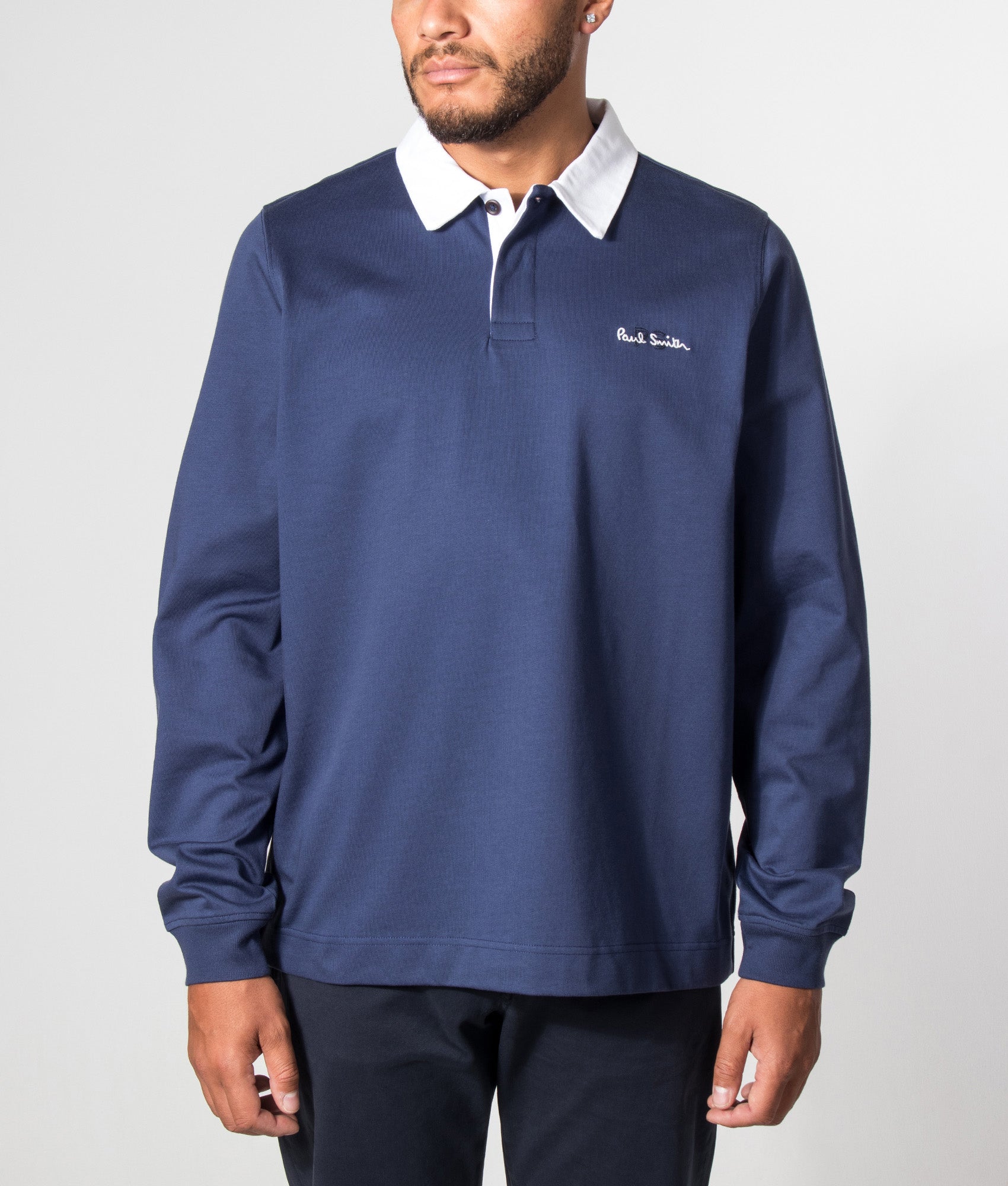 PS Paul Smith Casual Fit PS Logo Rugby Top in Inky Blue at EQVVS Menswear. Model front shot. 
