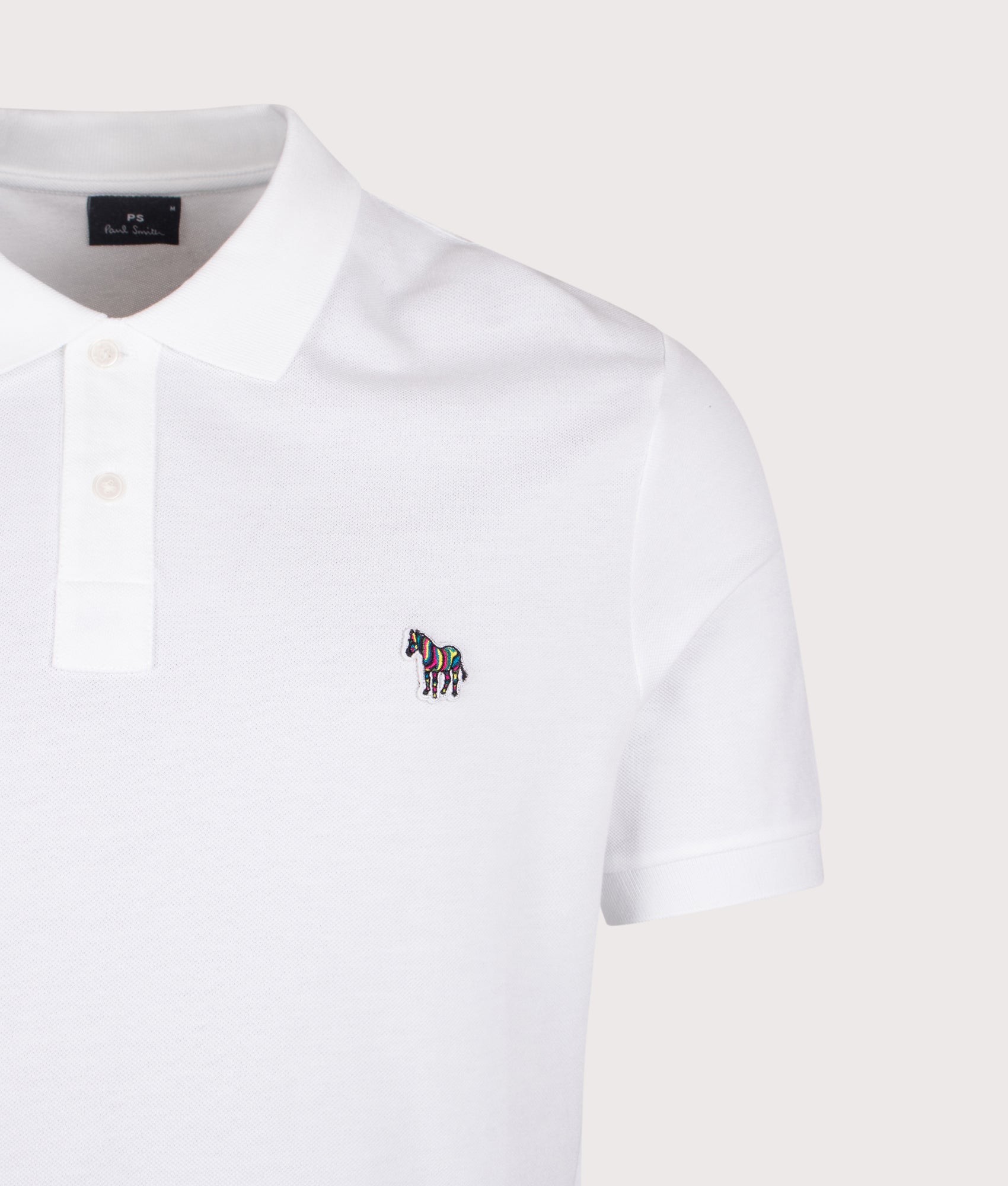 PS Paul Smith Zebra Logo Polo Shirt in White at EQVVS Menswear. Detail shot.