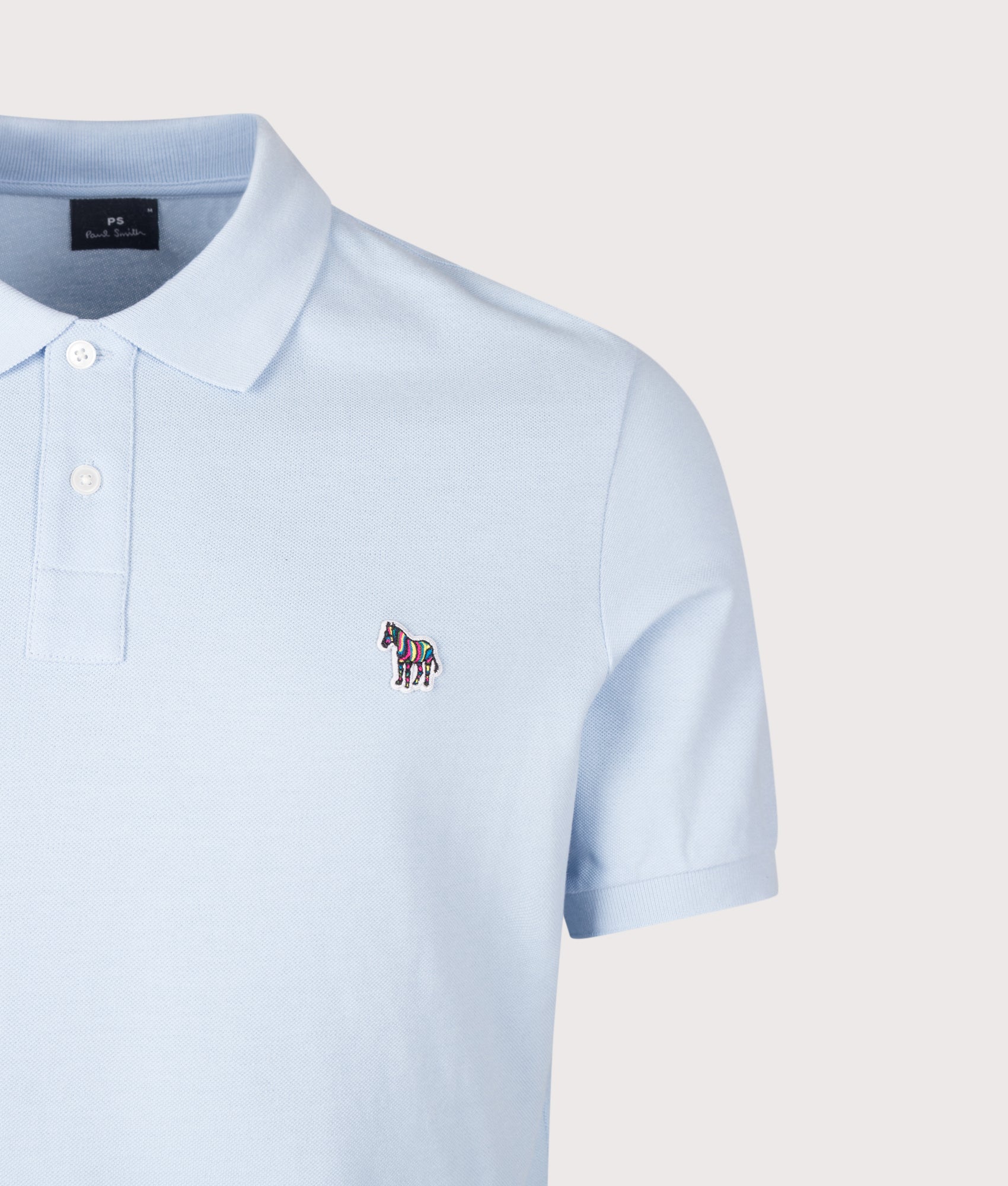 PS Paul Smith Zebra Logo Polo Shirt in Light Blue at EQVVS Menswear. Detail shot.