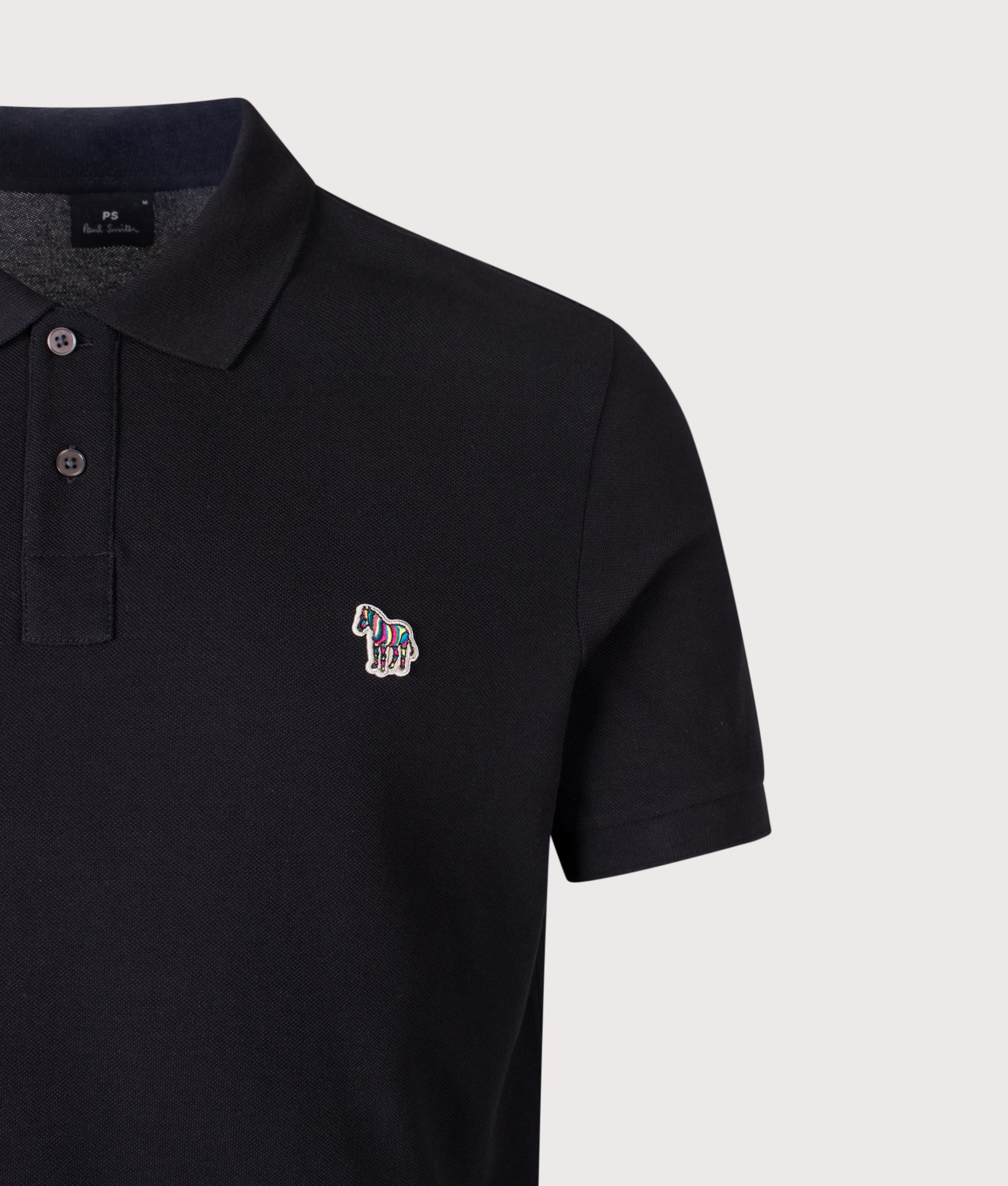 PS Paul Smith Zebra Logo Polo Shirt in Black at EQVVS Menswear. Detail shot.