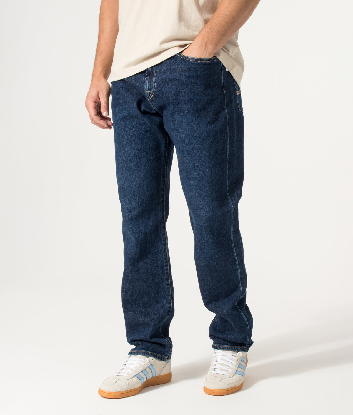 PS Paul Smith Relaxed Tapered Fit Jeans in Dark Colour Wash at EQVVS Menswear. Angled model front shot.