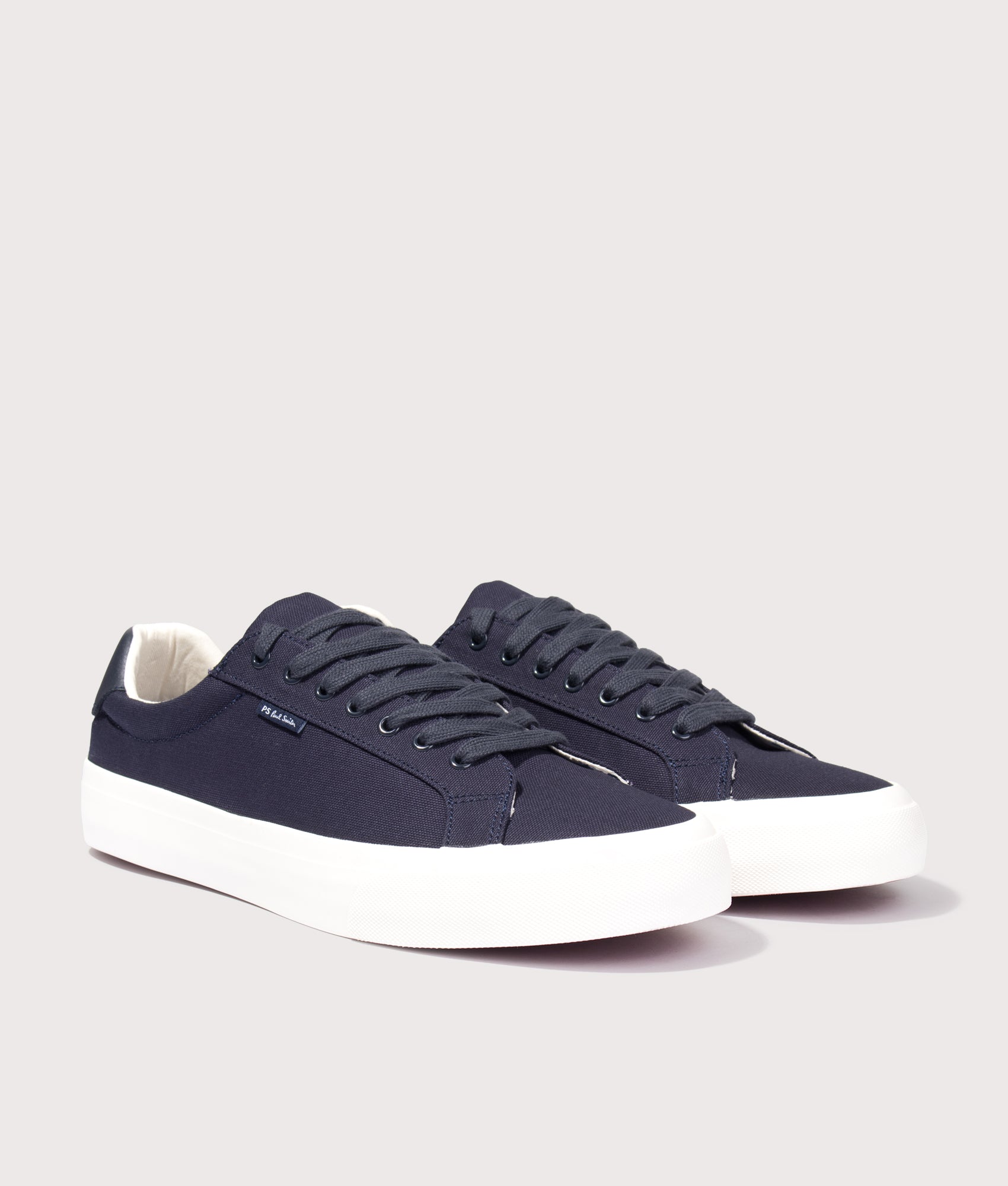 PS Paul Smith Amos Trainers in Navy at EQVVS Menswear. Angled front shot.