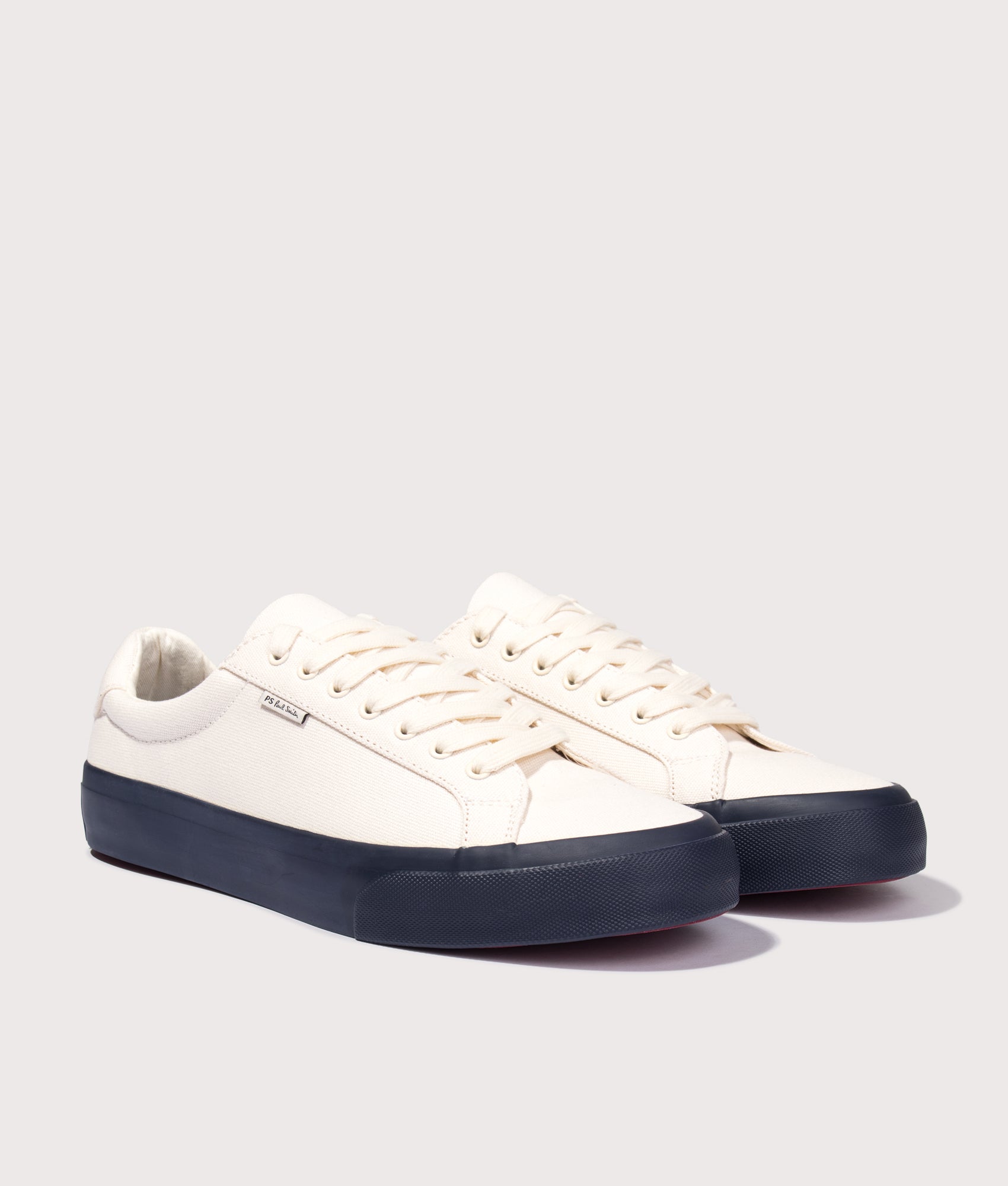 PS Paul Smith Amos Trainers in Off White at EQVVS Menswear. Angled front shot.