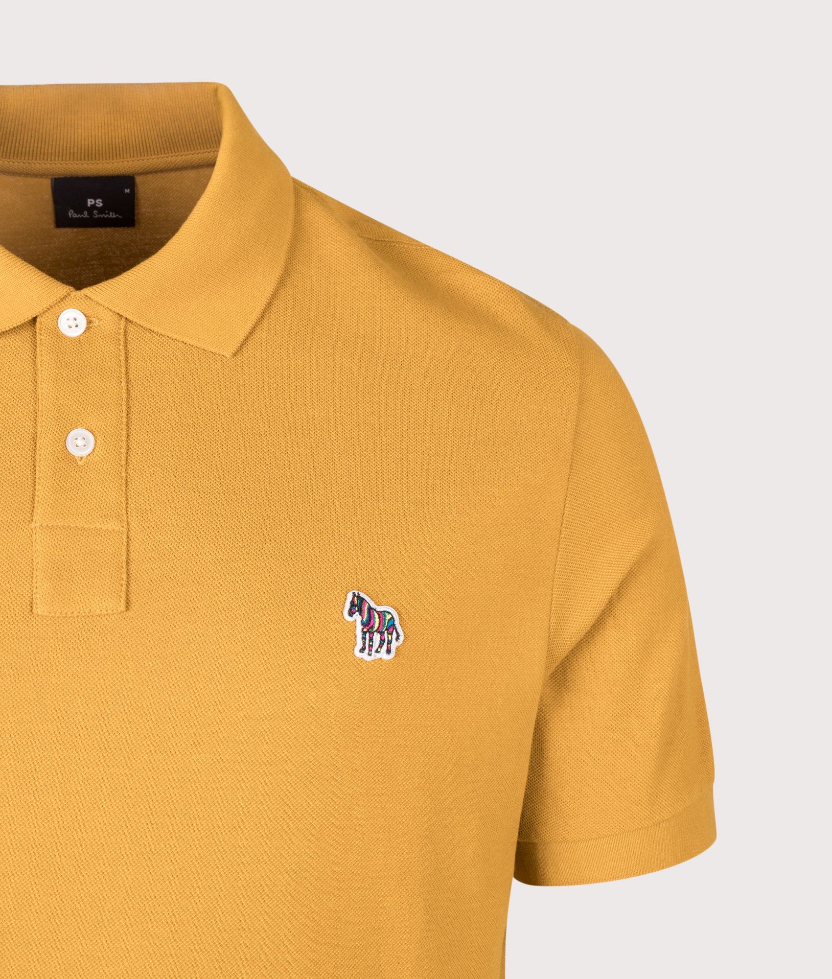 PS Paul Smith Regular Fit Zebra Polo Shirt in Ochre at EQVVS Menswear. Detail shot.