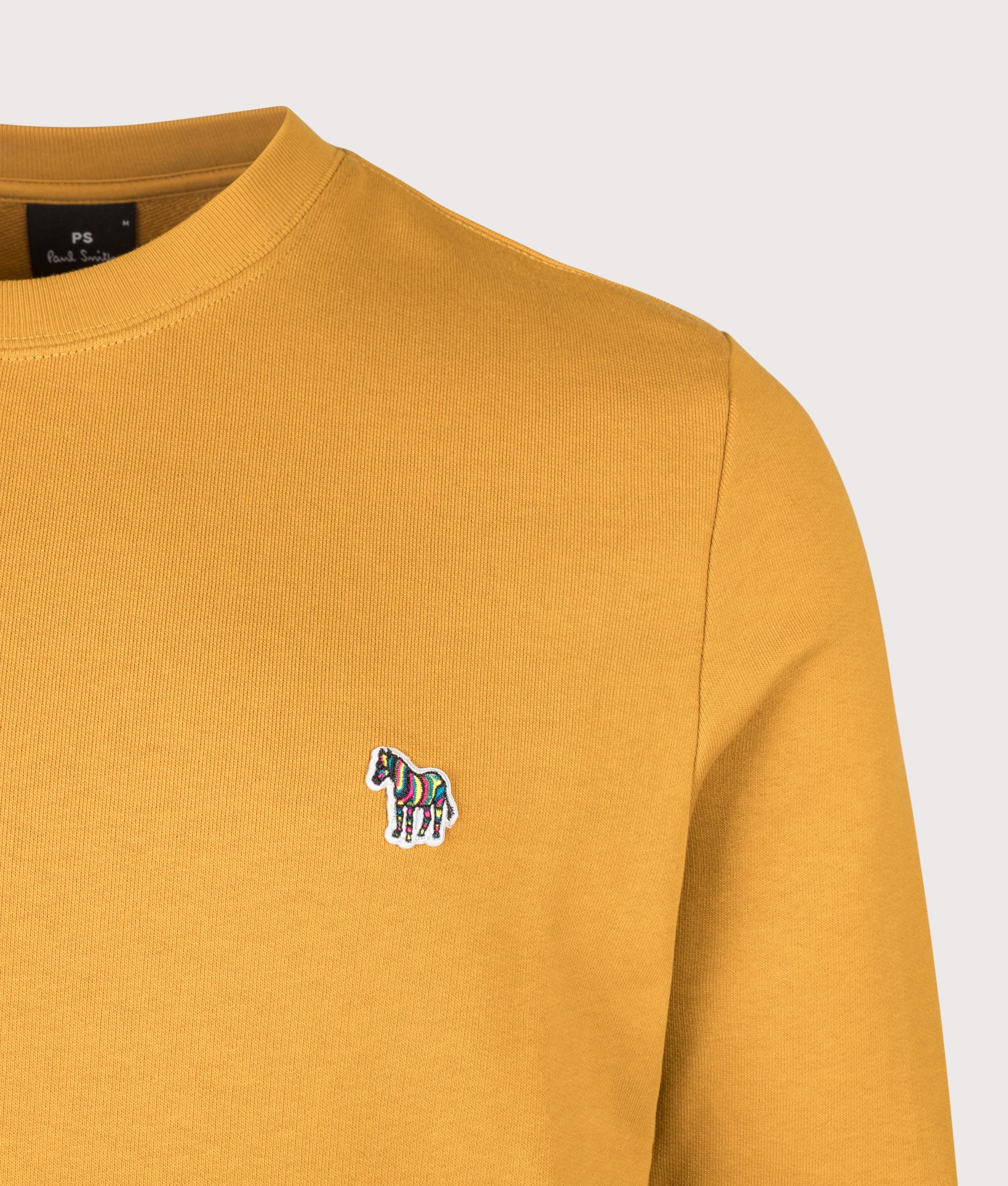 PS Paul Smith Organic Cotton Zebra Logo Sweatshirt in Ochre at EQVVS Menswear. Detail shot.