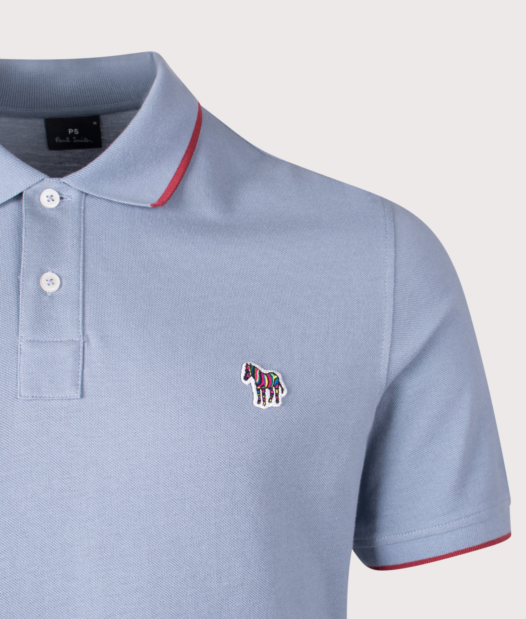 Zebra Badge Polo Shirt in Blue | 100% Organic Cotton | PS Paul Smith | EQVVS | Front detail shot 