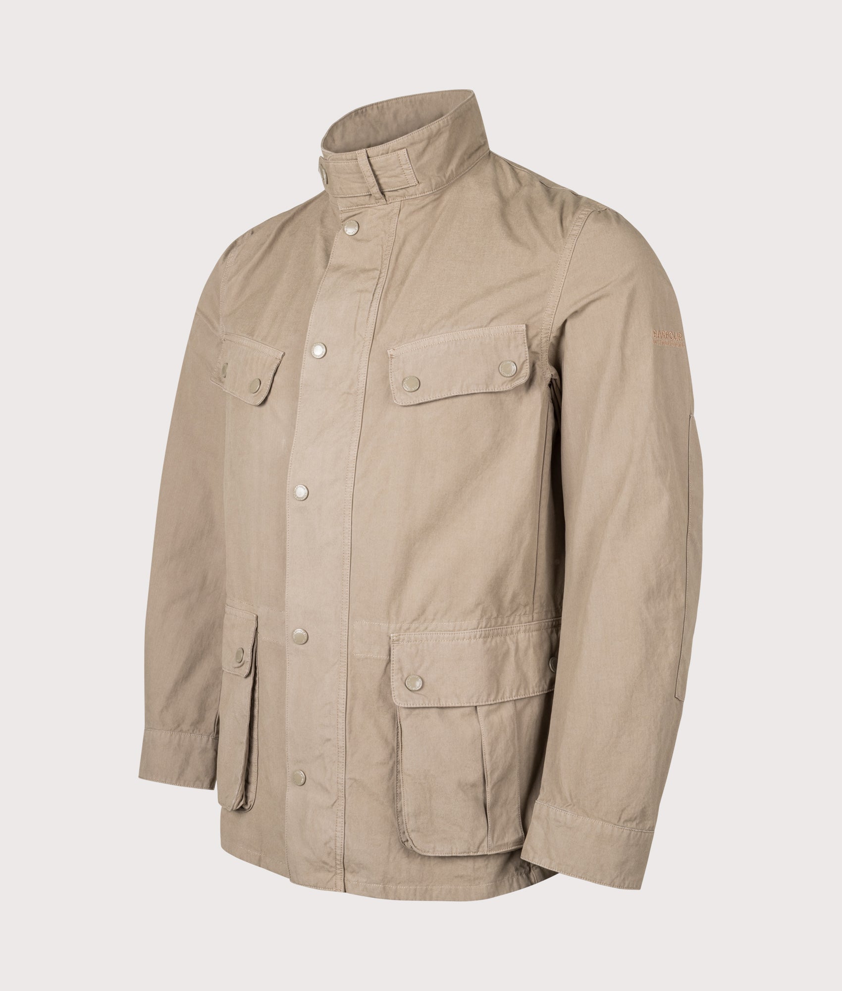Barbour B.Intl Garment Dyed Duke Casual Jacket in Timberwolf at EQVVS Menswear. Angled front shot.