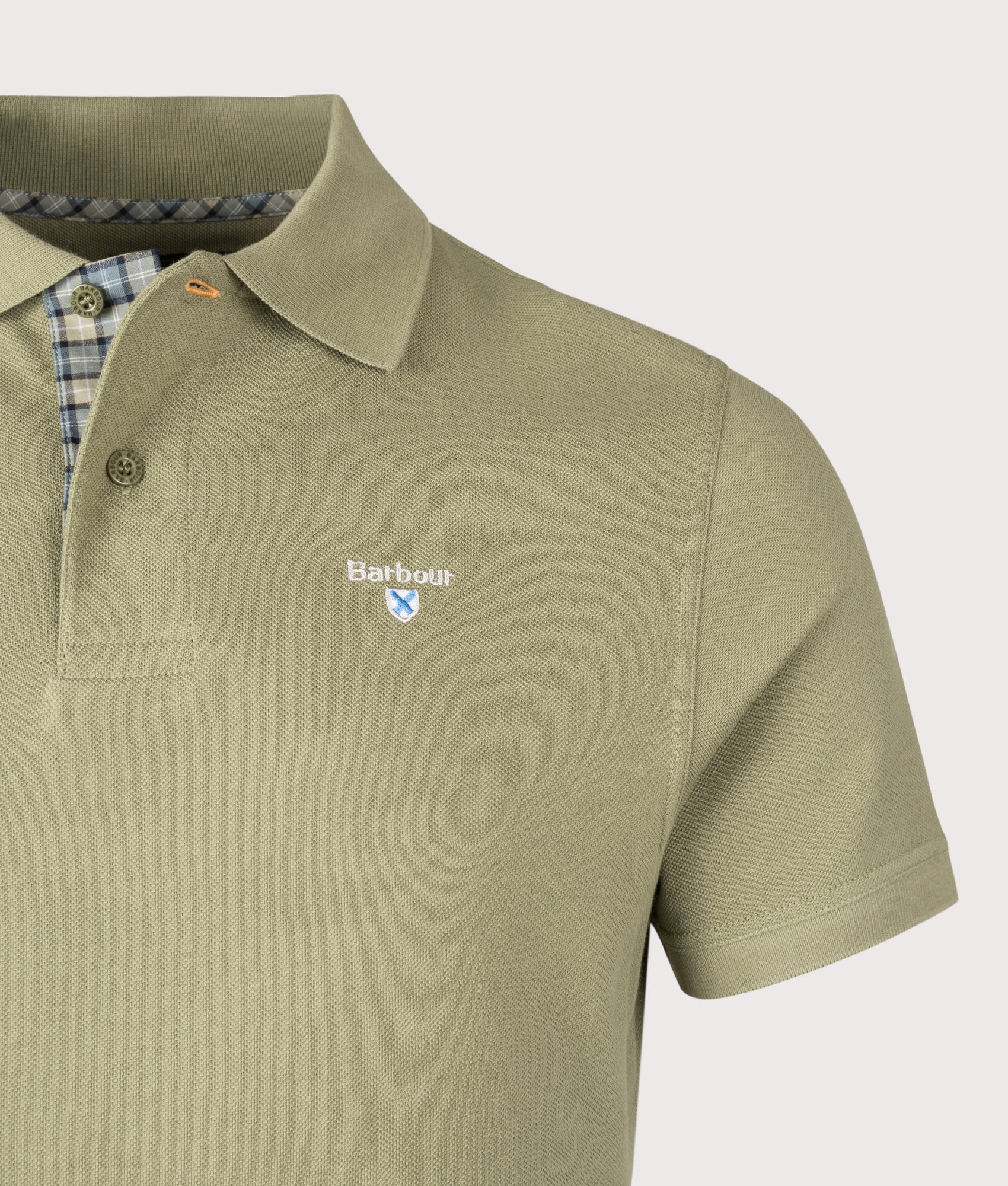 Barbour Tartan Pique Polo Shirt in Laurel Green at EQVVS Menswear. Detail shot.