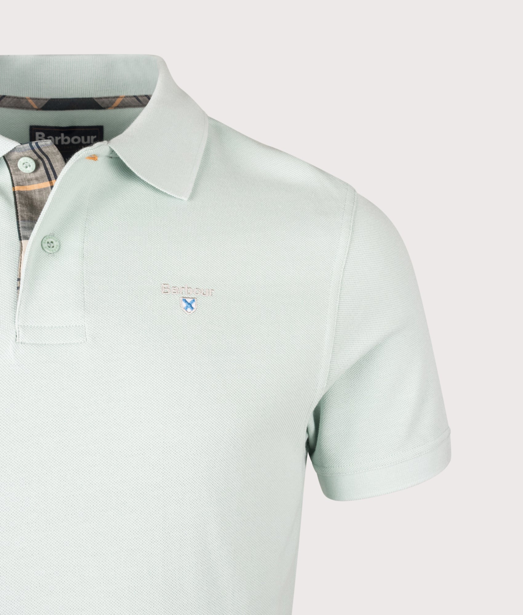 Barbour Tartan Piqué Polo Shirt in Mint Blue at EQVVS Menswear. Detail shot. 