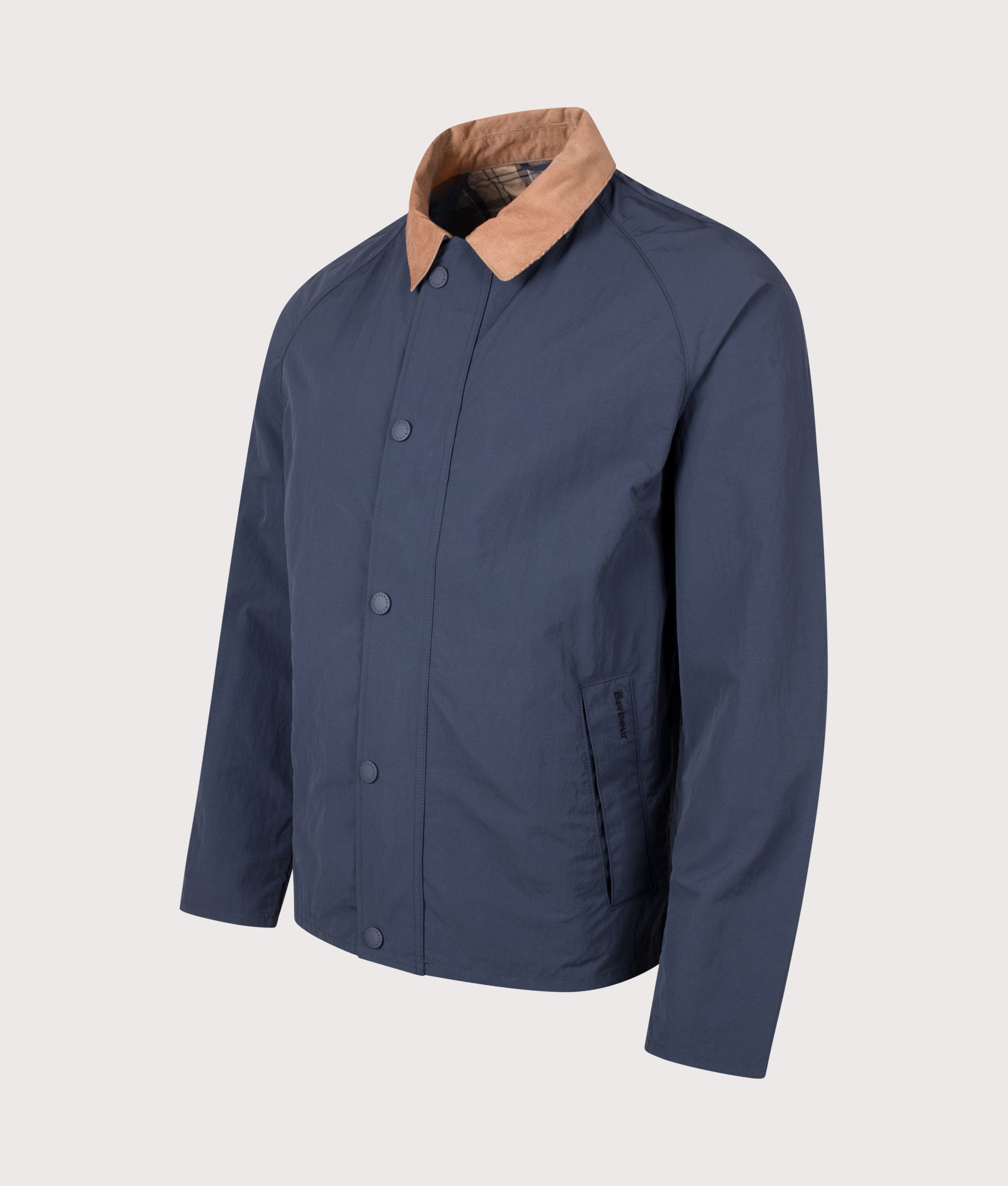 Barbour Lifestyle Tracker Showerproof Jacket in Navy at EQVVS Menswear. Angled front shot.