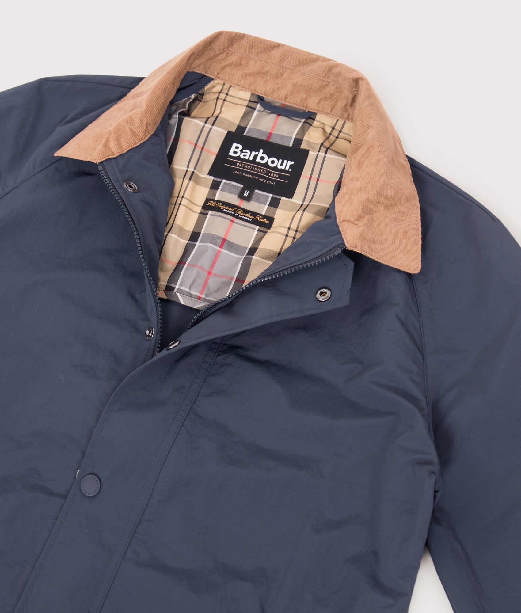 Barbour Lifestyle Tracker Showerproof Jacket in Navy at EQVVS Menswear. Open collar shot.