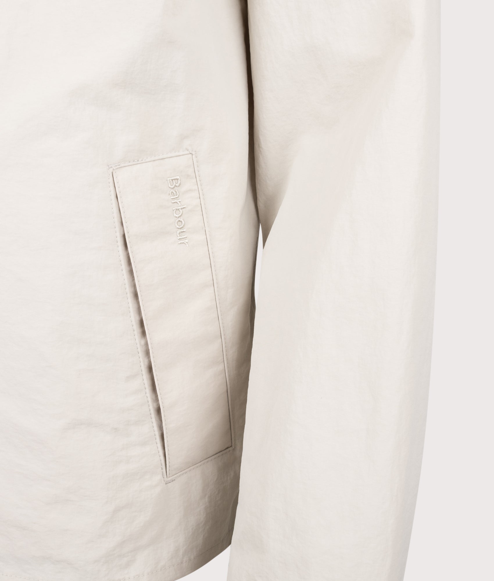 Barbour Lifestyle Tracker Showerproof Jacket in Mist at EQVVS Menswear. Detail shot.