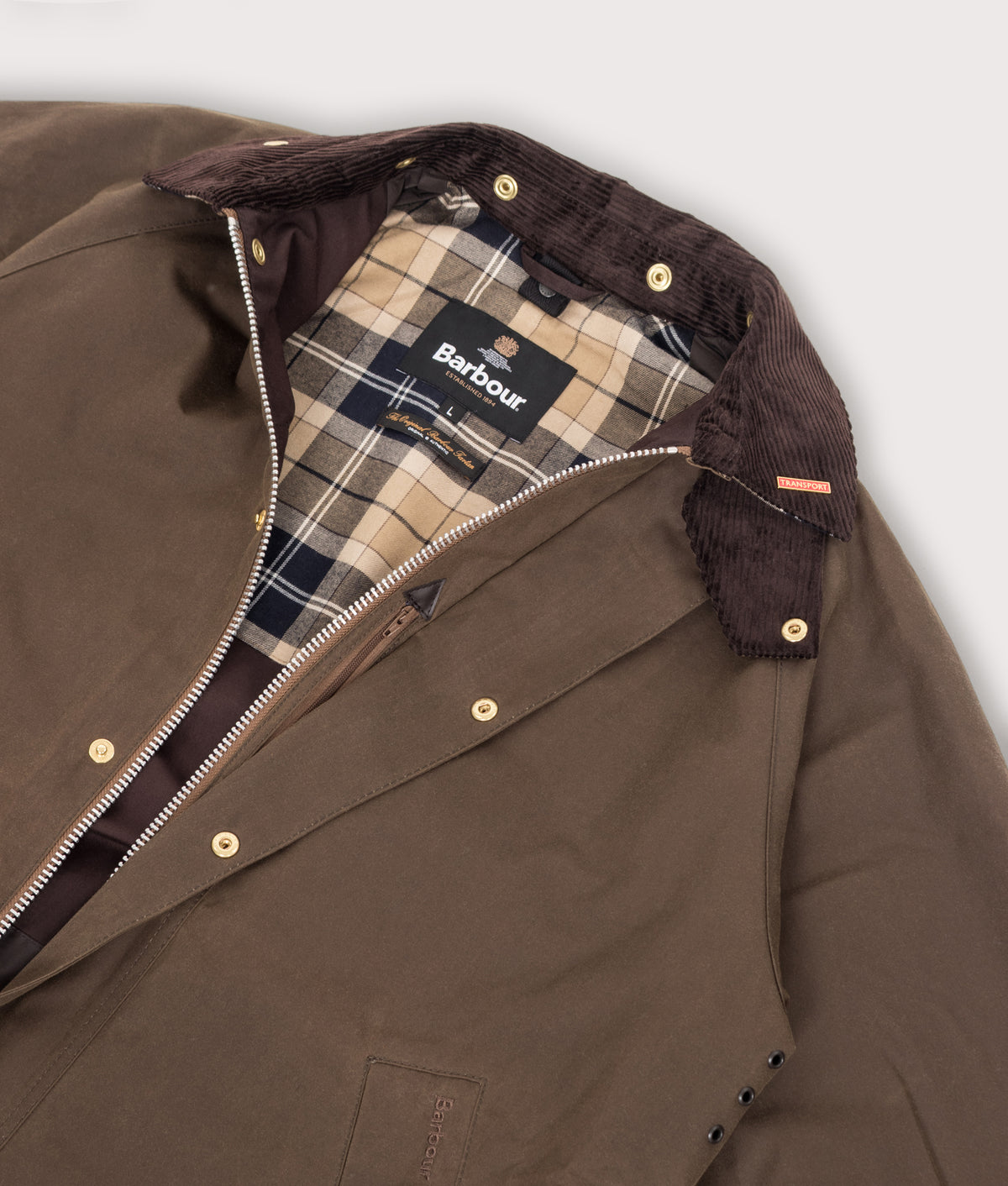Barbour Lifestyle Icons Transport Wax Jacket in Brown at EQVVS Menswear. Flat shot.