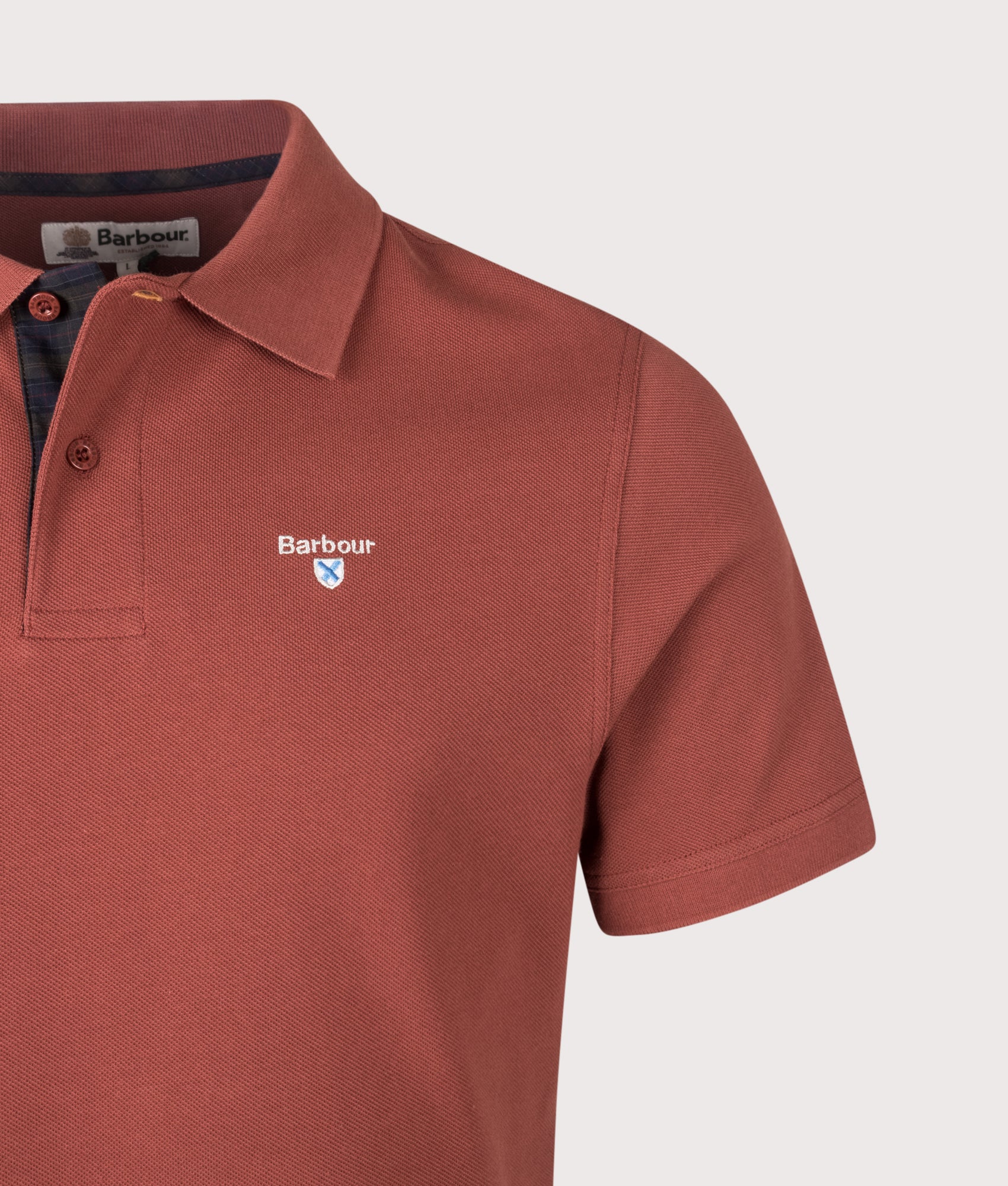 Barbour Tartan Pique Polo Shirt in Russet at EQVVS Menswear. Detail shot.