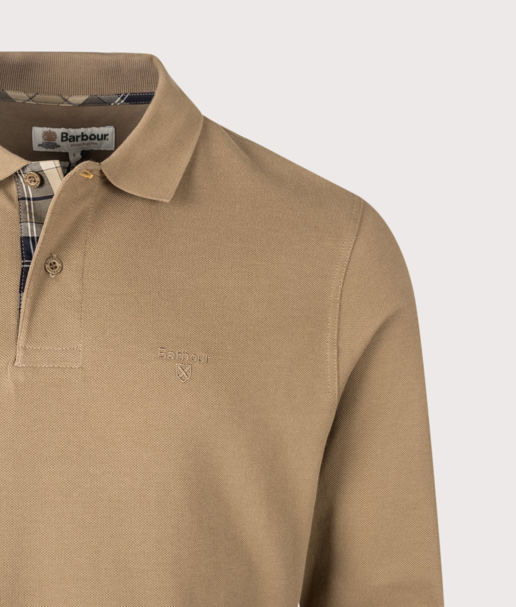 Barbour Lifestyle Regular Fit Essential Long Sleeve Tartan Piqué Polo Shirt in Sandstone at EQVVS Menswear. Detail shot.