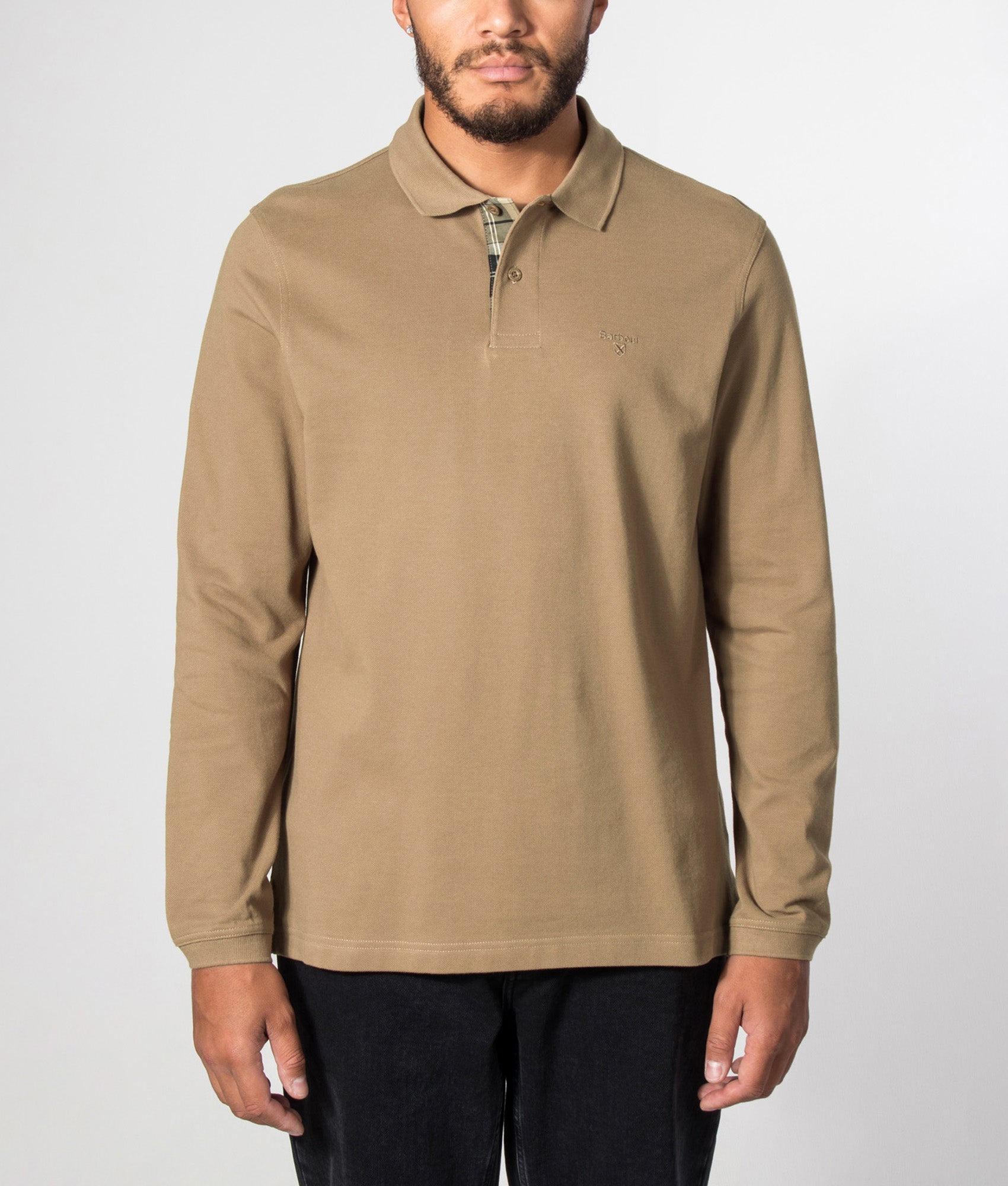 Barbour Lifestyle Regular Fit Essential Long Sleeve Tartan Piqué Polo Shirt in Sandstone at EQVVS Menswear. Model front shot.