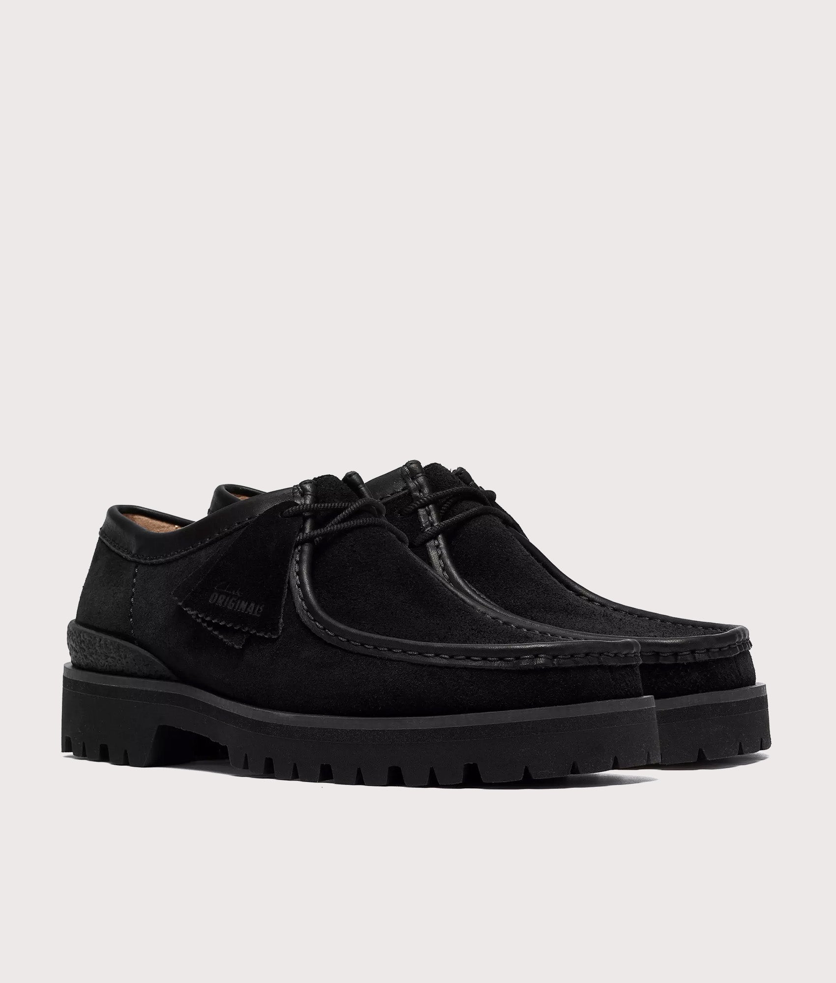 Clarks Originals Walla Yukoner shoes in black Combi Suede at EQVVS Menswear. Angled front shot.