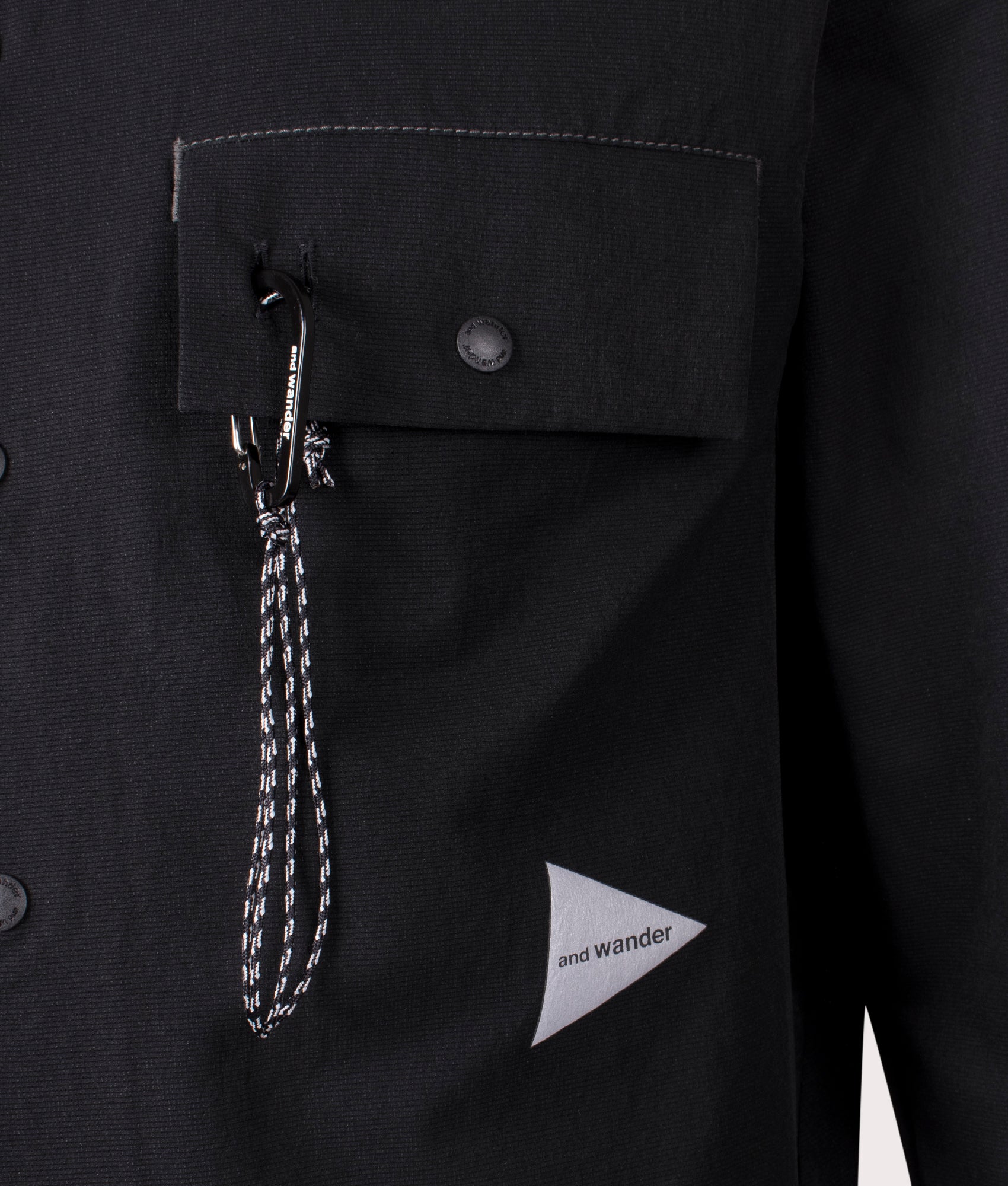 and wander Dry Breathable Hoodie in Black at EQVVS. Detail Shot.