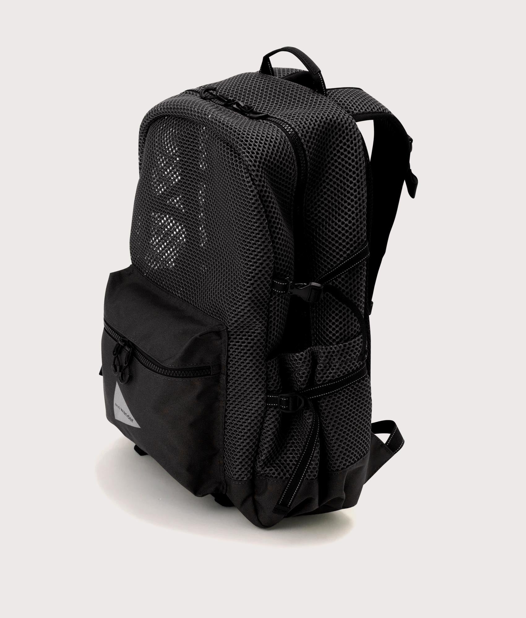 and wander 3D Mesh Backpack in Black at EQVVS Menswear. Angled front shot.