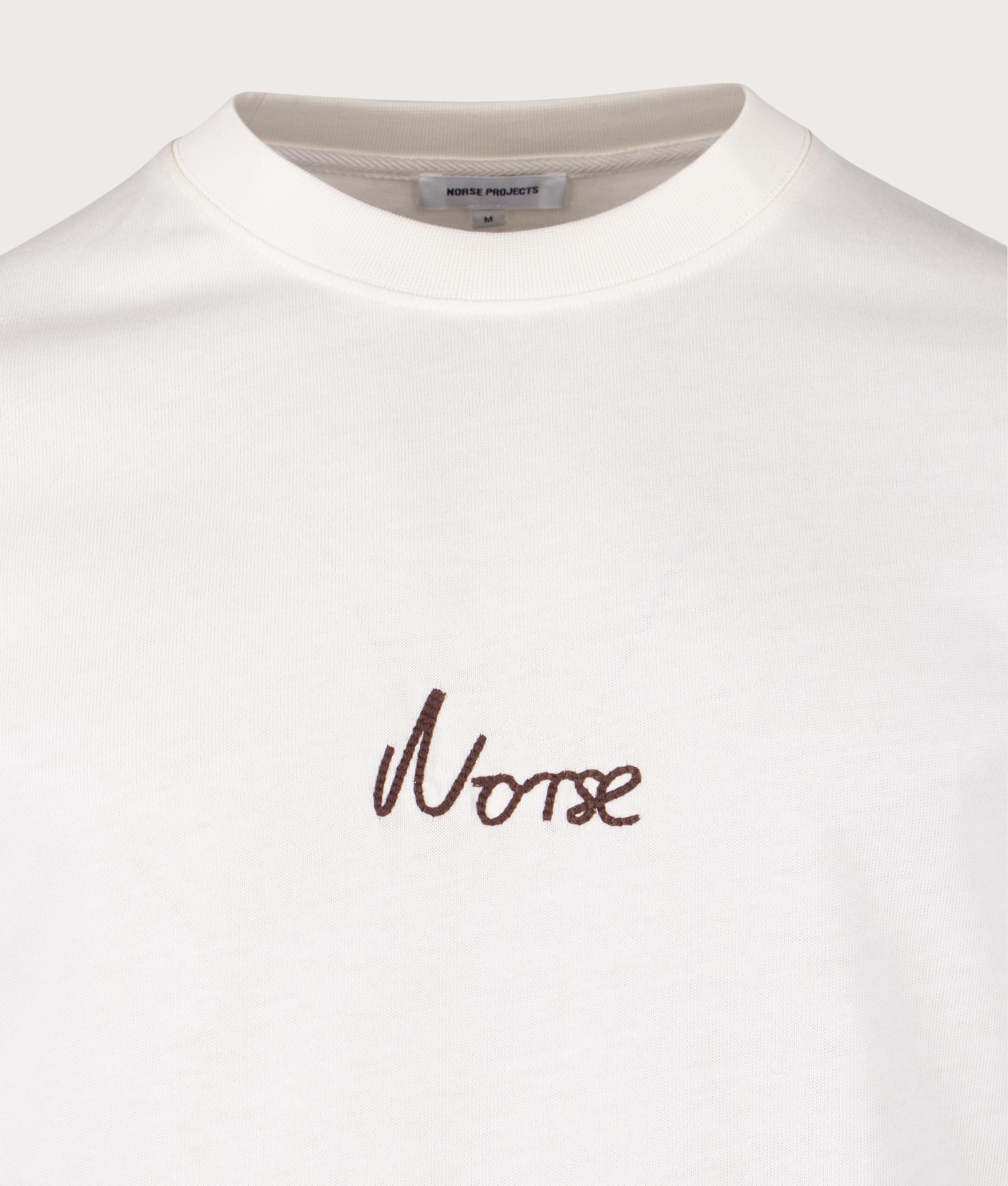Norse Projects Johannes Organic Chain Stitch Logo T-Shirt in 0957 Ecru detail shot at EQVVS