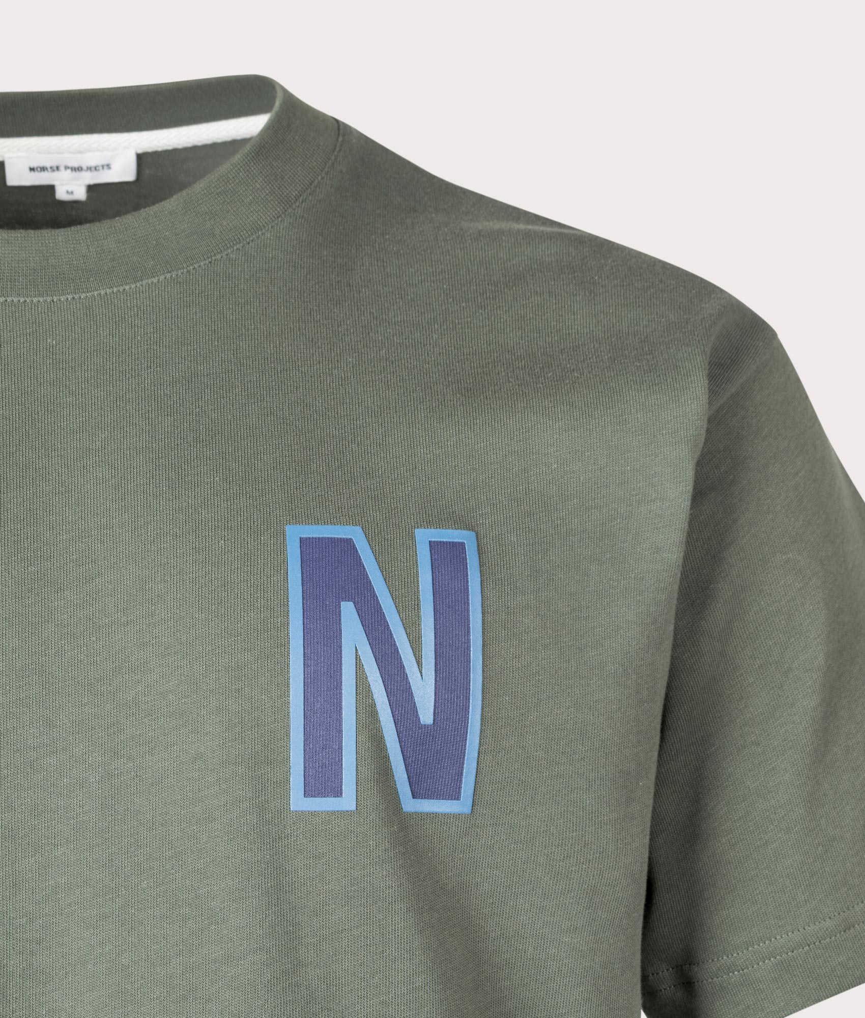Norse Projects Simon Loose Organic Heavy Jersey Large N T-Shirt in 8022 Spruce Green Detail shot at EQVVS