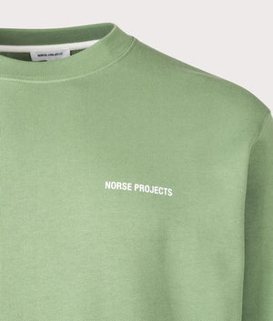 Norse Projects Relaxed Fit Arne Relaxed Organic Logo Sweatshirt in 8124 Linden Green Detail shot at EQVVS