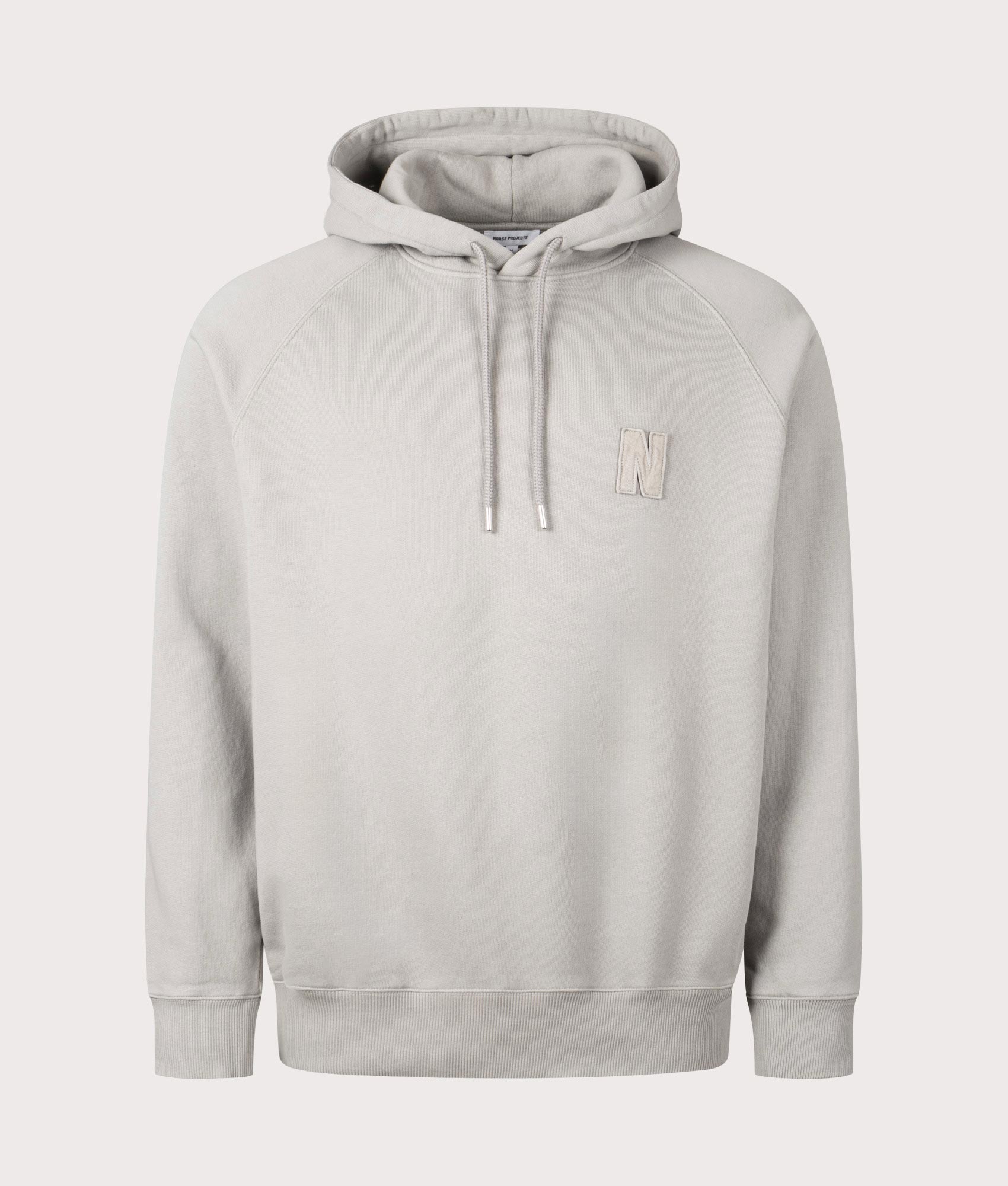 Norse Projects Relaxed Fit Marten Raglan N Patch Hoodie in Weather Grey at EQVVS Menswear Front Shot