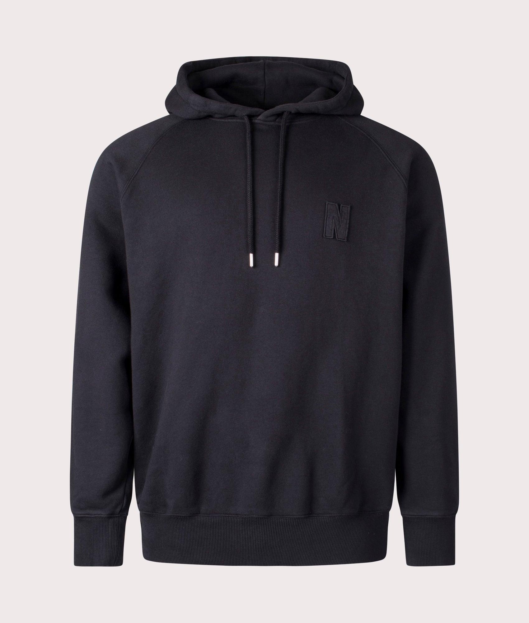 Norse Projects Relaxed Fit Marten Raglan N Patch Hoodie in Black at EQVVS Menswear Front Shot