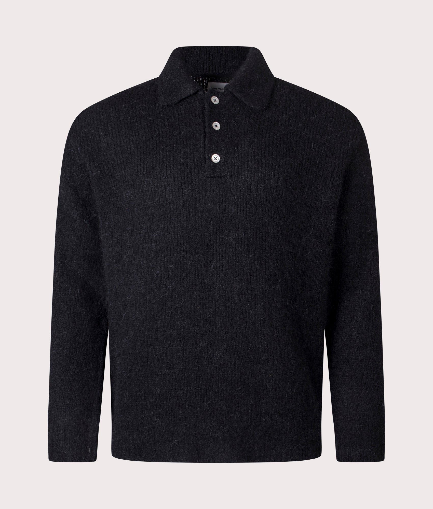 Norse Projects Relaxed Fit Rasmus Brushed Polo Shirt in Black at EQVVS Menswear. Front shot.