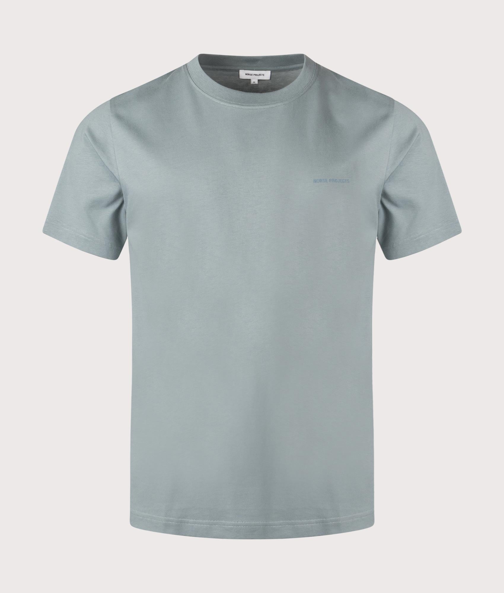 Norse Projects Johannes Organic NORSE Logo Print T-Shirt in Greyish Blue. Shot at EQVVS. Front shot. 
