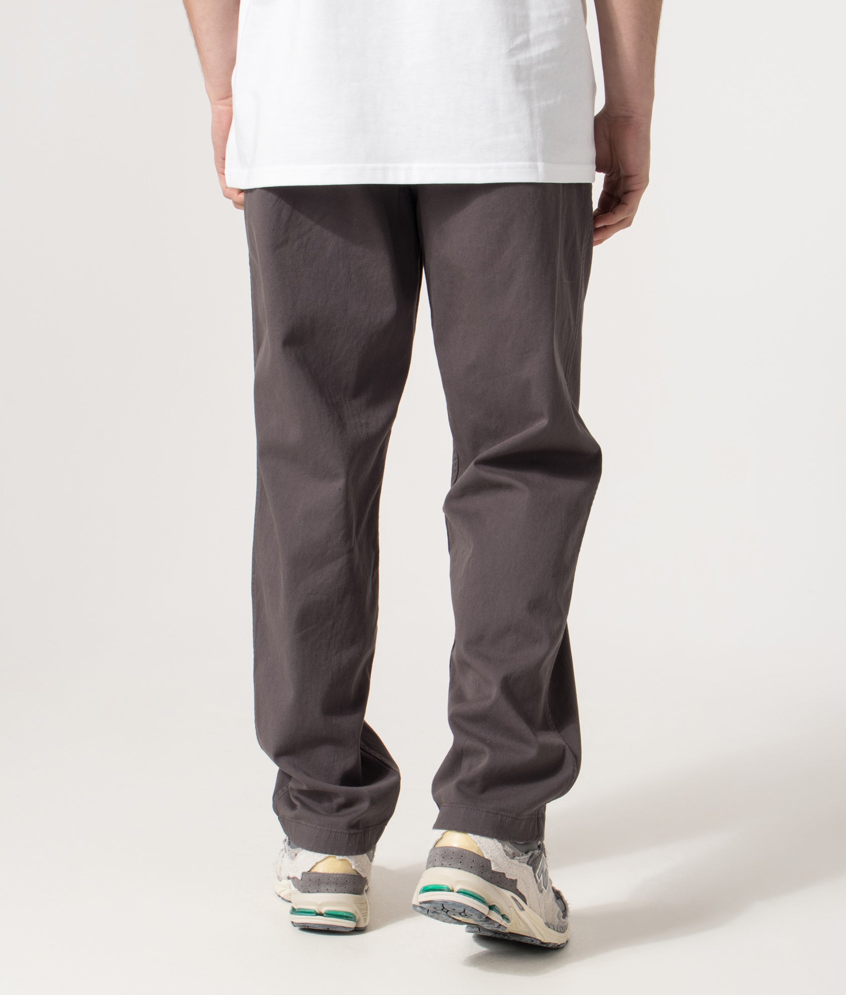 Norse Projects Relaxed Fit Ezra Organic Stretch Twill Trousers in Graphite at EQVVS Menswear. Model back shot.